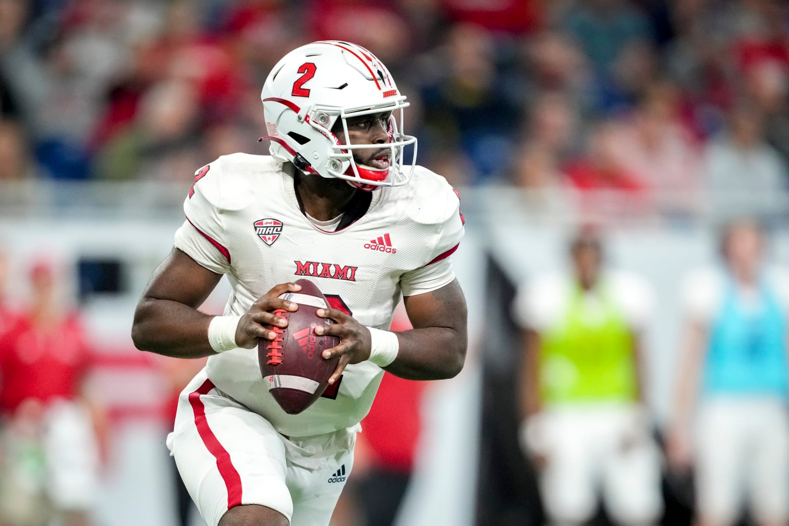 DETROIT, MICHIGAN - DECEMBER 02: Aveon Smith #2 of the Miami (Oh) Redhawks looks to pass the ball against the Toledo Rockets during the second quarter of the MAC Championship at Ford Field on December 02, 2023 in Detroit, Michigan. (Photo by Nic Antaya/Getty Images)