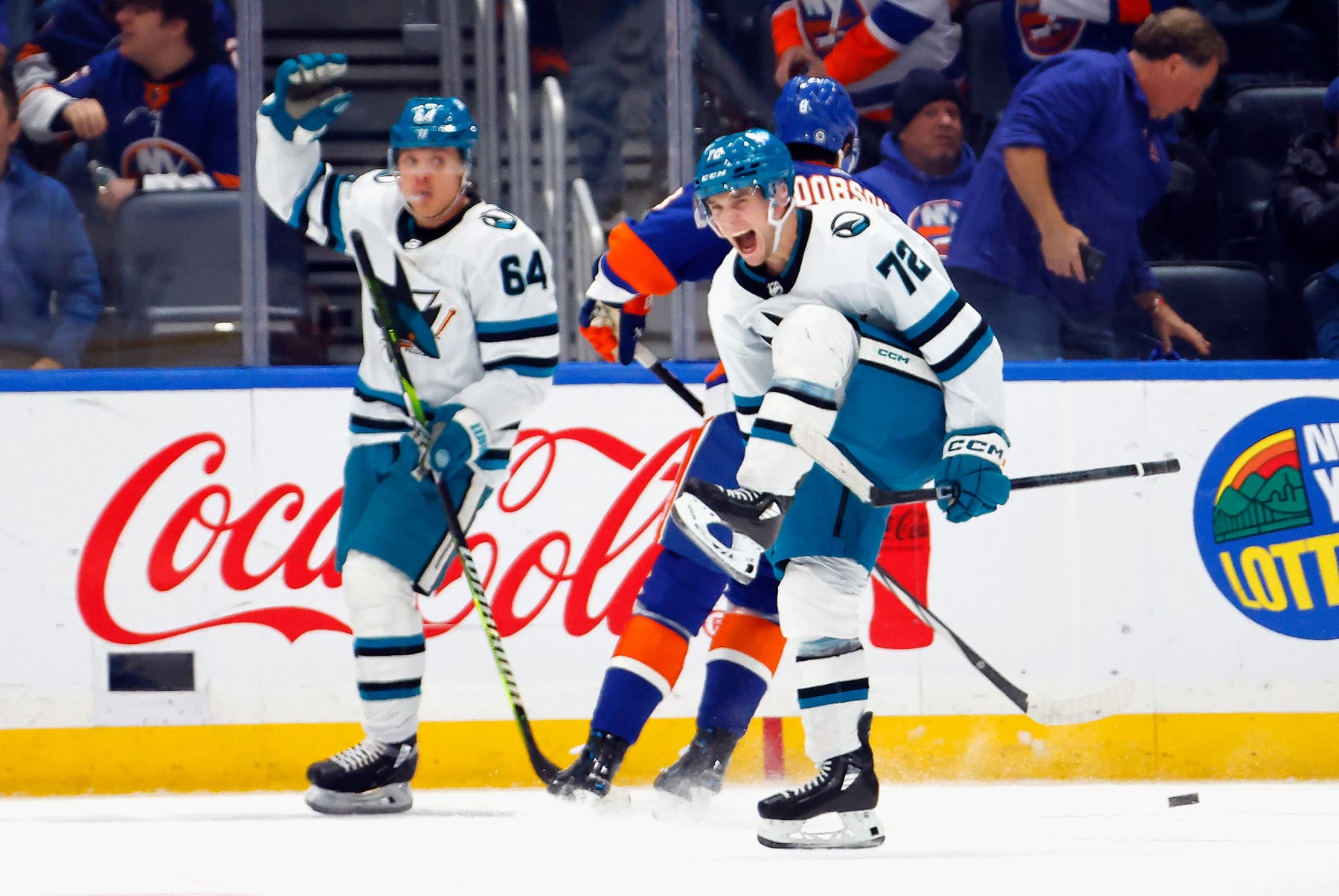 ELMONT, NEW YORK - DECEMBER 05: William Eklund #72 of the San Jose Sharks scores the game-winning goal in overtime against Ilya Sorokin #3 of the New York Islanders at UBS Arena on December 05, 2023 in Elmont, New York. The Sharks defeated the Islanders 5-4 in overtime. (Photo by Bruce Bennett/Getty Images)