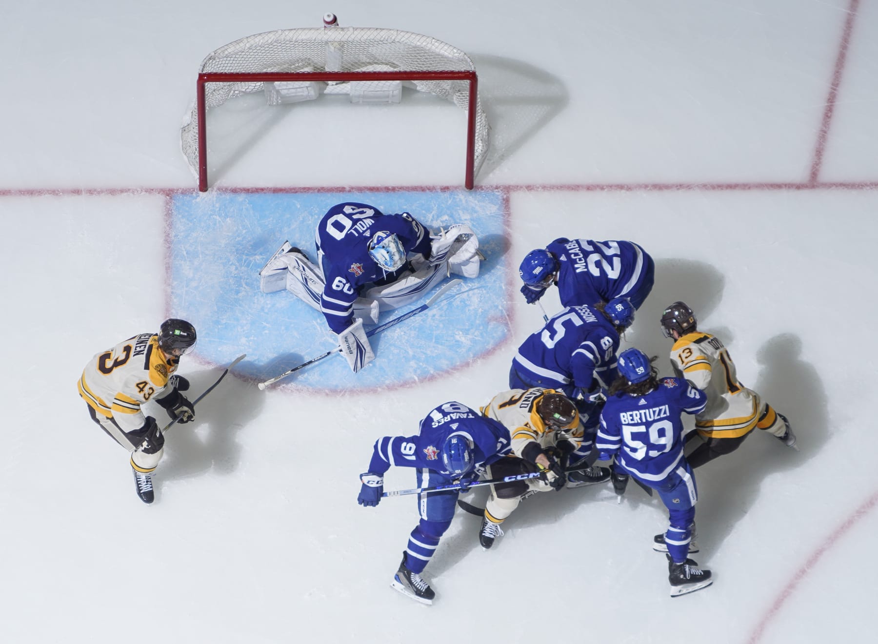 TORONTO, ON - DECEMBER 2: Joseph Woll #60, Tyler Bertuzzi #59 and John Tavares #91 of the Toronto Maple Leafs defend the net against Brad Marchand #63 and Charlie Coyle #13 of the Boston Bruins during the second period at the Scotiabank Arena on December 2, 2023 in Toronto, Ontario, Canada. (Photo by Mark Blinch/NHLI via Getty Images)