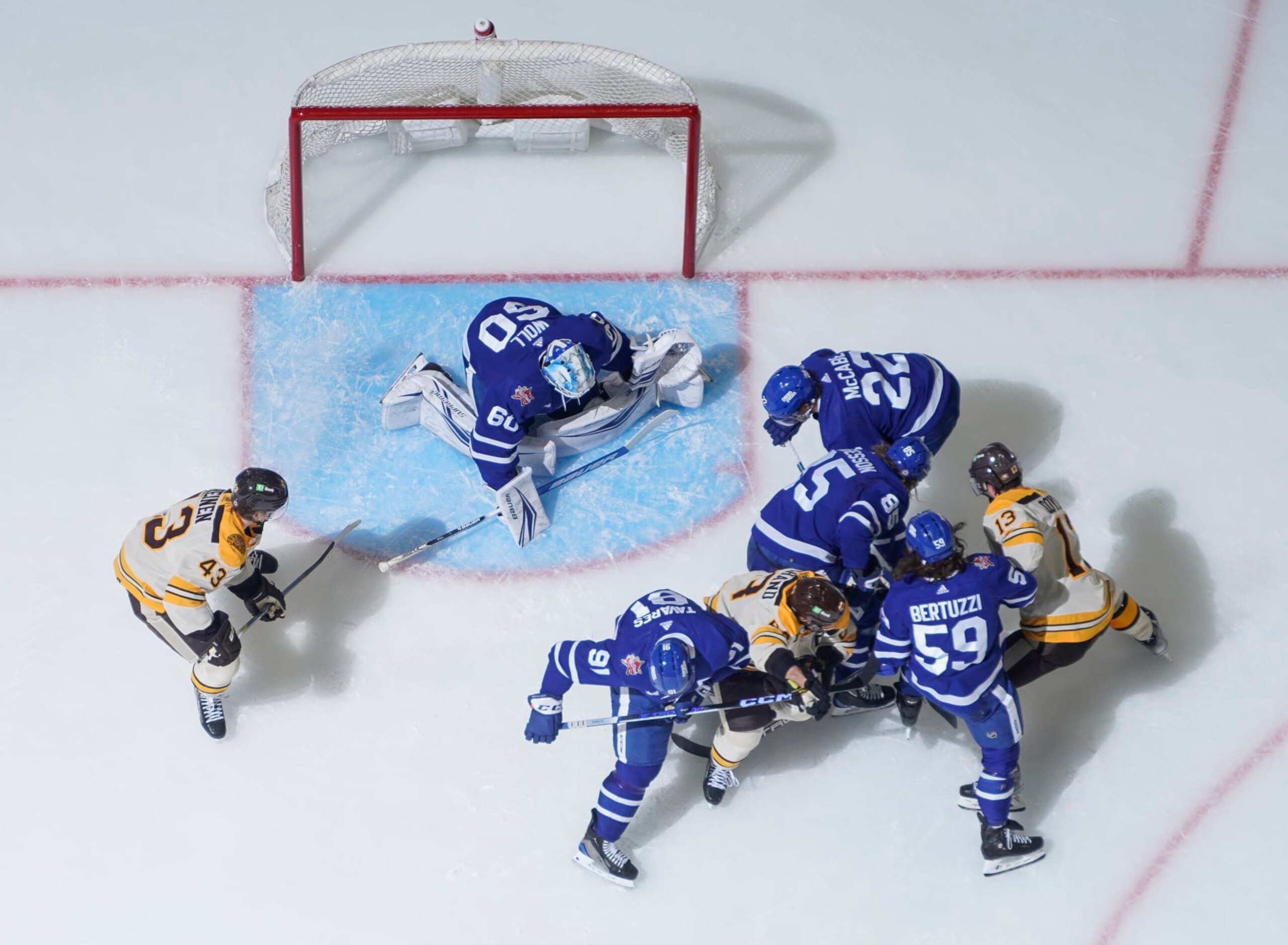 TORONTO, ON - DECEMBER 2: Joseph Woll #60, Tyler Bertuzzi #59 and John Tavares #91 of the Toronto Maple Leafs defend the net against Brad Marchand #63 and Charlie Coyle #13 of the Boston Bruins during the second period at the Scotiabank Arena on December 2, 2023 in Toronto, Ontario, Canada. (Photo by Mark Blinch/NHLI via Getty Images)