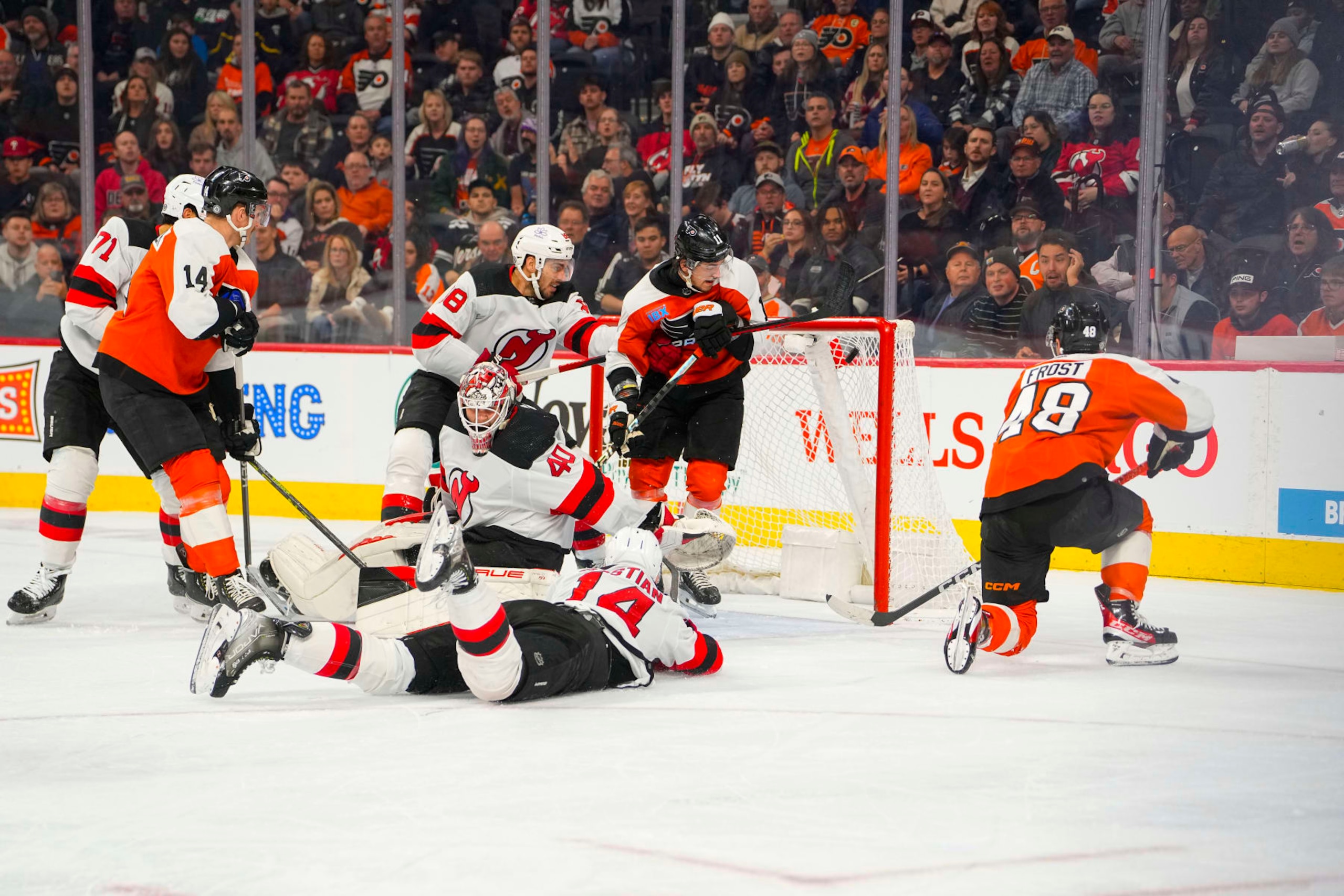 PHILADELPHIA, PA - NOVEMBER 30: Philadelphia Flyers Center Morgan Frost (48) scores a goal on New Jersey Devils Goalie Akira Schmid (40)during the second period of the National Hockey League game between the New Jersey Devils and the Philadelphia Flyers on November 30, 2023. At the Wells Fargo Center in Philadelphia, PA. (Photo by Gregory Fisher/Icon Sportswire via Getty Images)