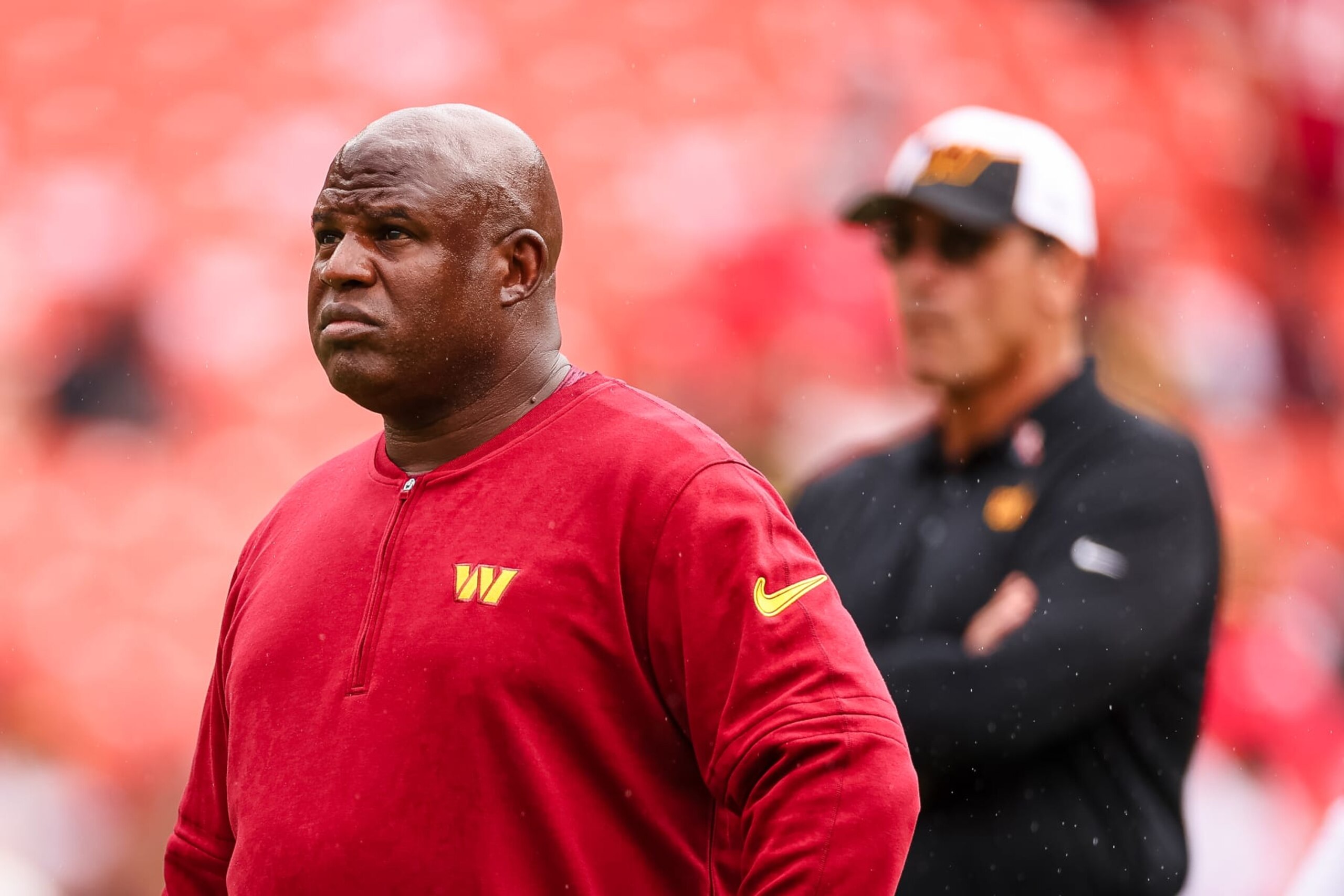 LANDOVER, MD - SEPTEMBER 10: Assistant head coach and offensive coordinator Eric Bieniemy looks on as head coach Ron Rivera watches his team before the game against the Arizona Cardinals at FedExField on September 10, 2023 in Landover, Maryland. (Photo by Scott Taetsch/Getty Images)