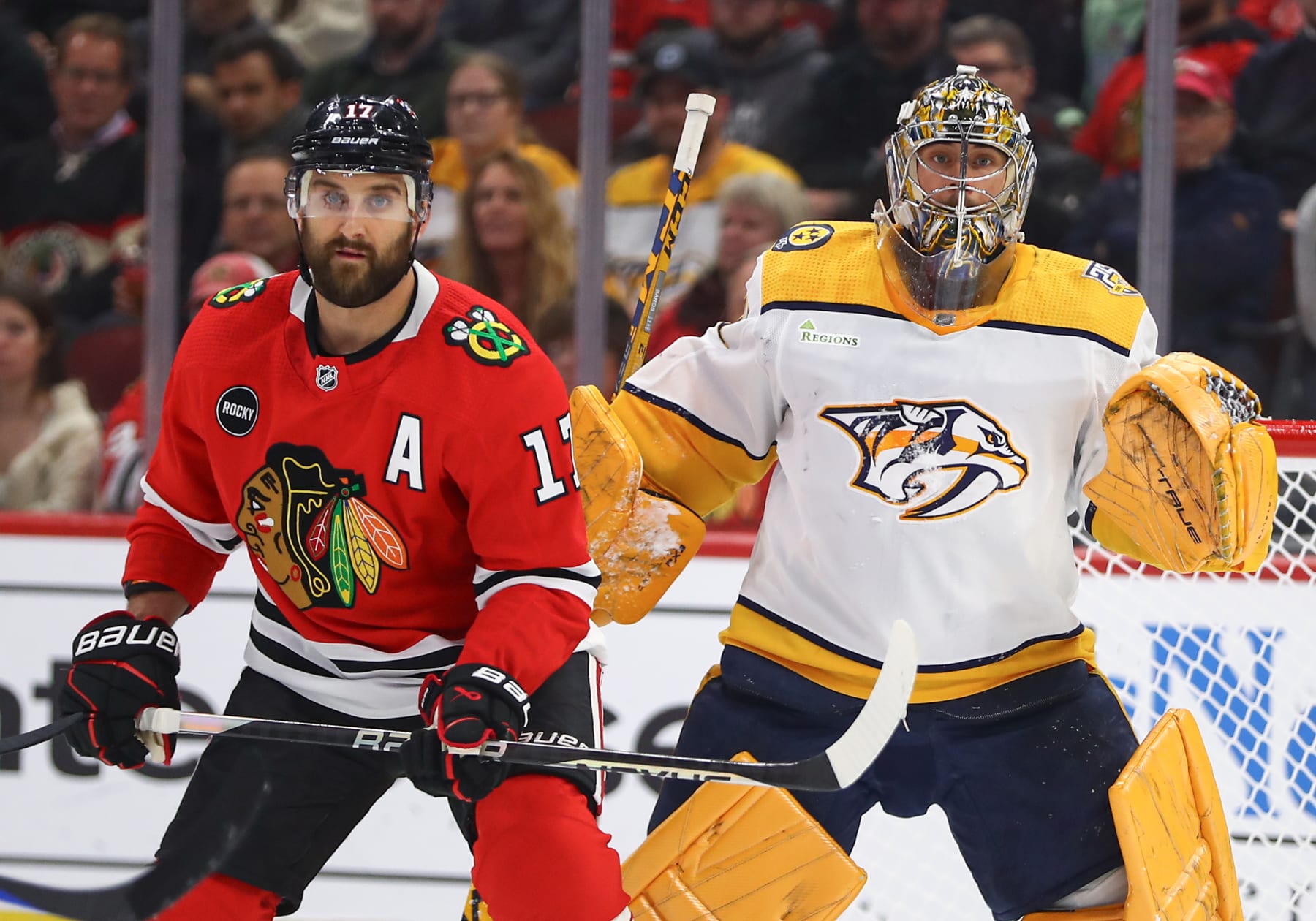 CHICAGO, IL - DECEMBER 05: Nick Foligno #17 of the Chicago Blackhawks stands in front of Juuse Saros #74 of the Nashville Predators  during the first period at the United Center on December 5, 2023 in Chicago, Illinois. (Photo by Melissa Tamez/Icon Sportswire via Getty Images)