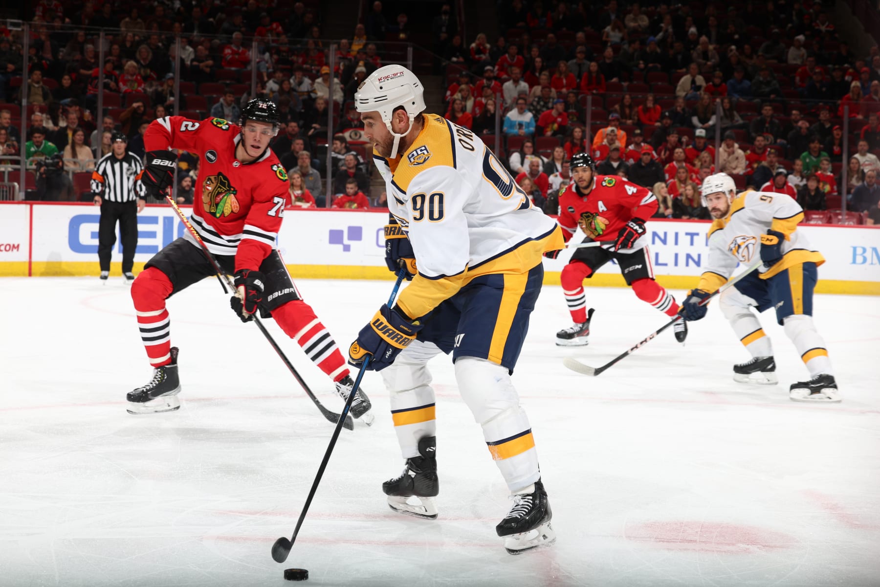 CHICAGO, ILLINOIS - DECEMBER 05: Ryan O'Reilly #90 of the Nashville Predators controls the puck in the third period against the Chicago Blackhawks at the United Center on December 05, 2023 in Chicago, Illinois. (Photo by Chase Agnello-Dean/NHLI via Getty Images)