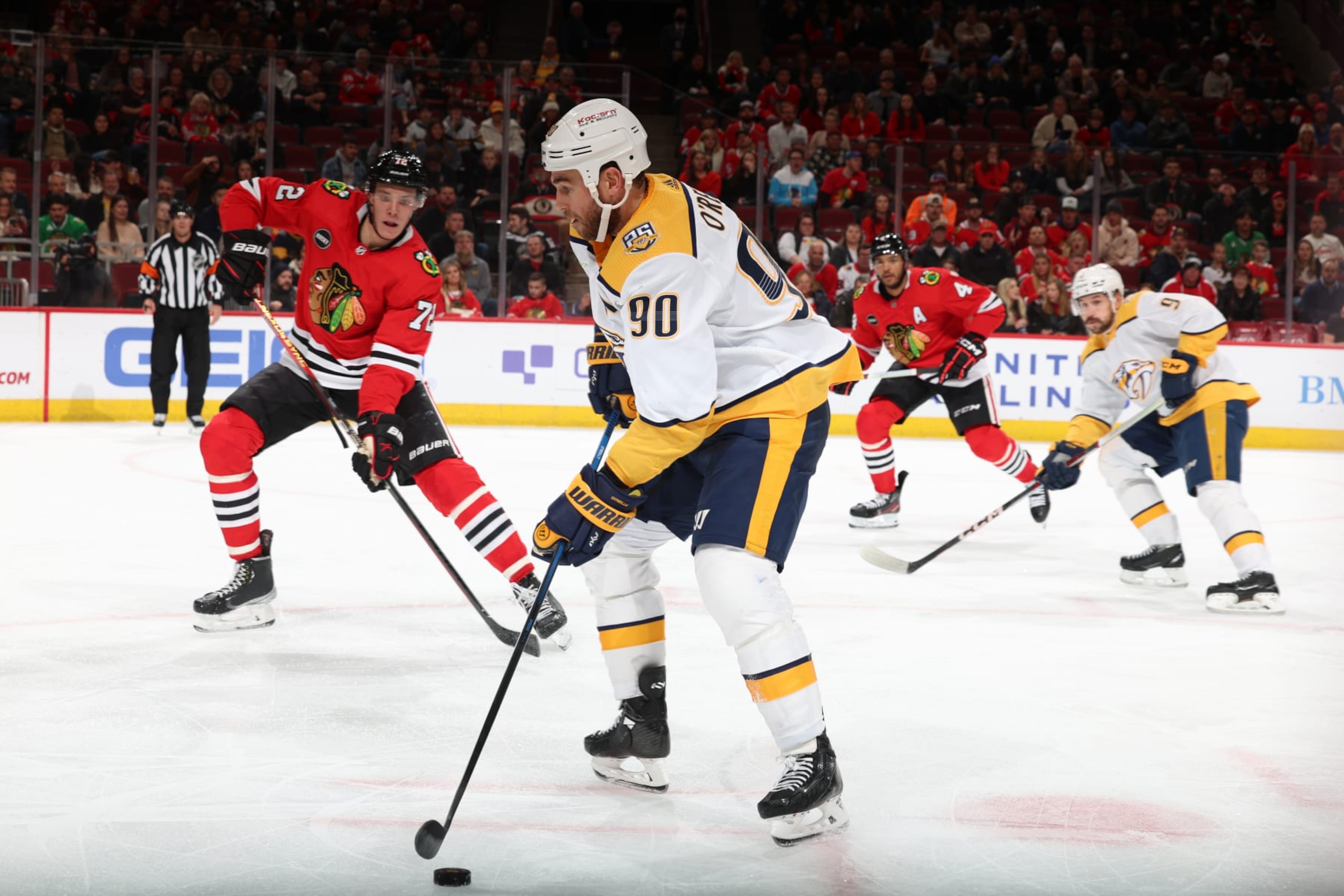 CHICAGO, ILLINOIS - DECEMBER 05: Ryan O'Reilly #90 of the Nashville Predators controls the puck in the third period against the Chicago Blackhawks at the United Center on December 05, 2023 in Chicago, Illinois. (Photo by Chase Agnello-Dean/NHLI via Getty Images) CHICAGO, ILLINOIS - DECEMBER 05: Ryan O'Reilly #90 of the Nashville Predators controls the puck in the third period against the Chicago Blackhawks at the United Center on December 05, 2023 in Chicago, Illinois. (Photo by Chase Agnello-Dean/NHLI via Getty Images)