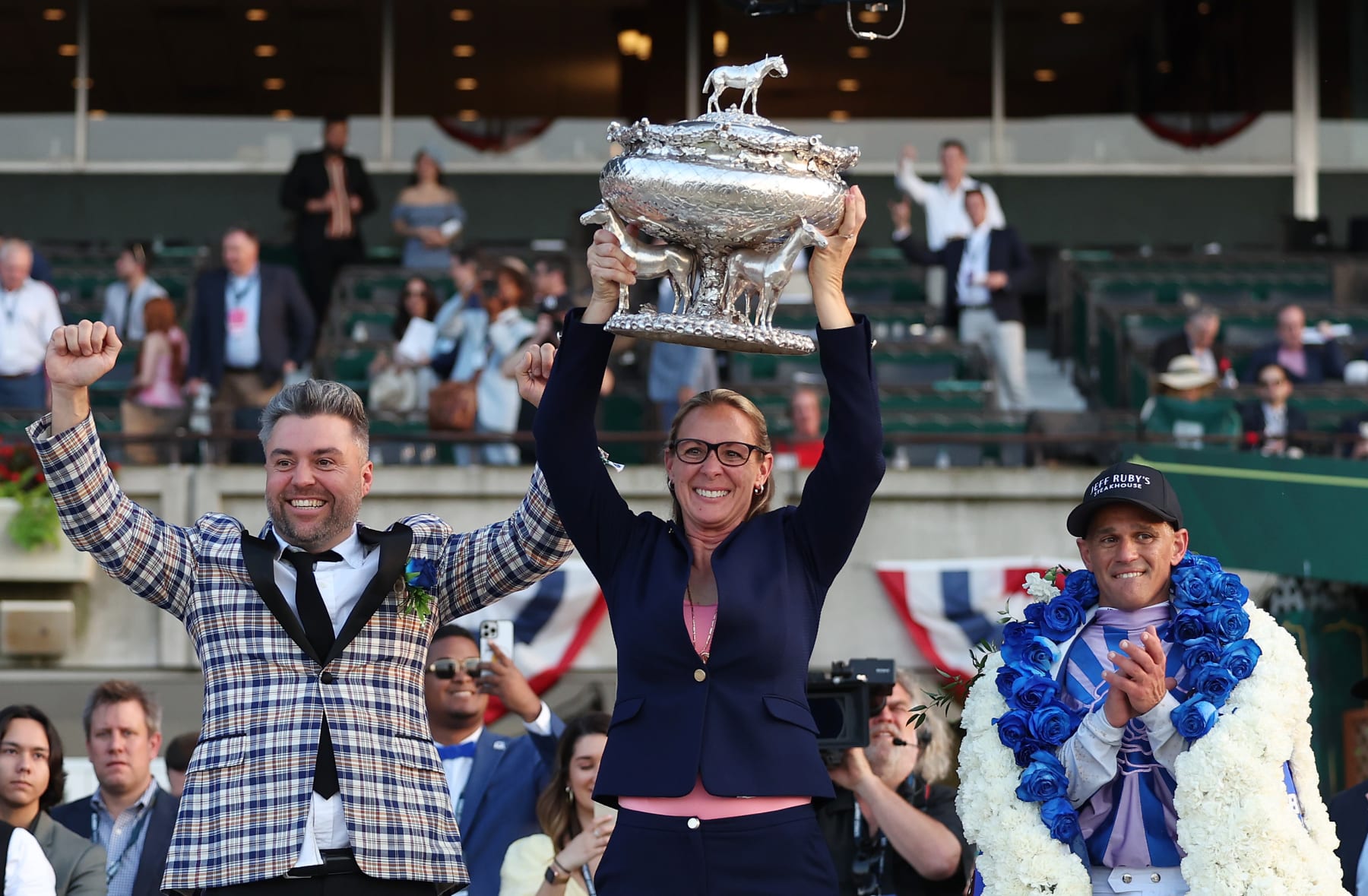 ELMONT, NEW YORK - JUNE 10:  Trainer Jena Antonucci  holds the winners trophy with owner Jon Ebbert (L) and Jockey Javier Castellano who rode riding Arcangelo  to win the 155th running of the Belmont Stakes at Belmont Park on June 10, 2023 in Elmont, New York. (Photo by Al Bello/Getty Images)