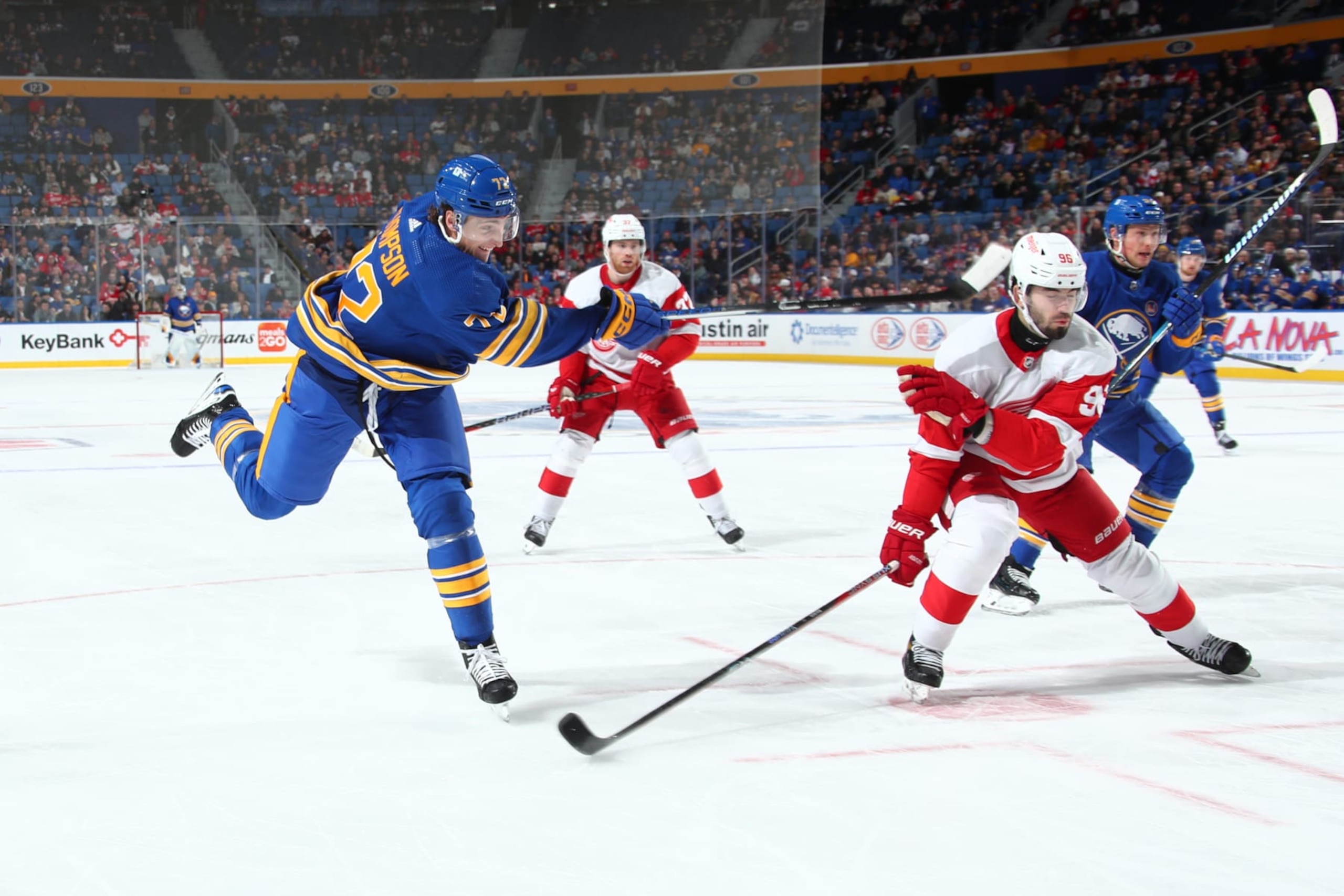 BUFFALO, NEW YORK - DECEMBER 5: Tage Thompson #72 of the Buffalo Sabres fires a shot while defended by Jake Walman #96 of the Detroit Red Wings during an NHL game on December 5, 2023 at KeyBank Center in Buffalo, New York. (Photo by Bill Wippert/NHLI via Getty Images)