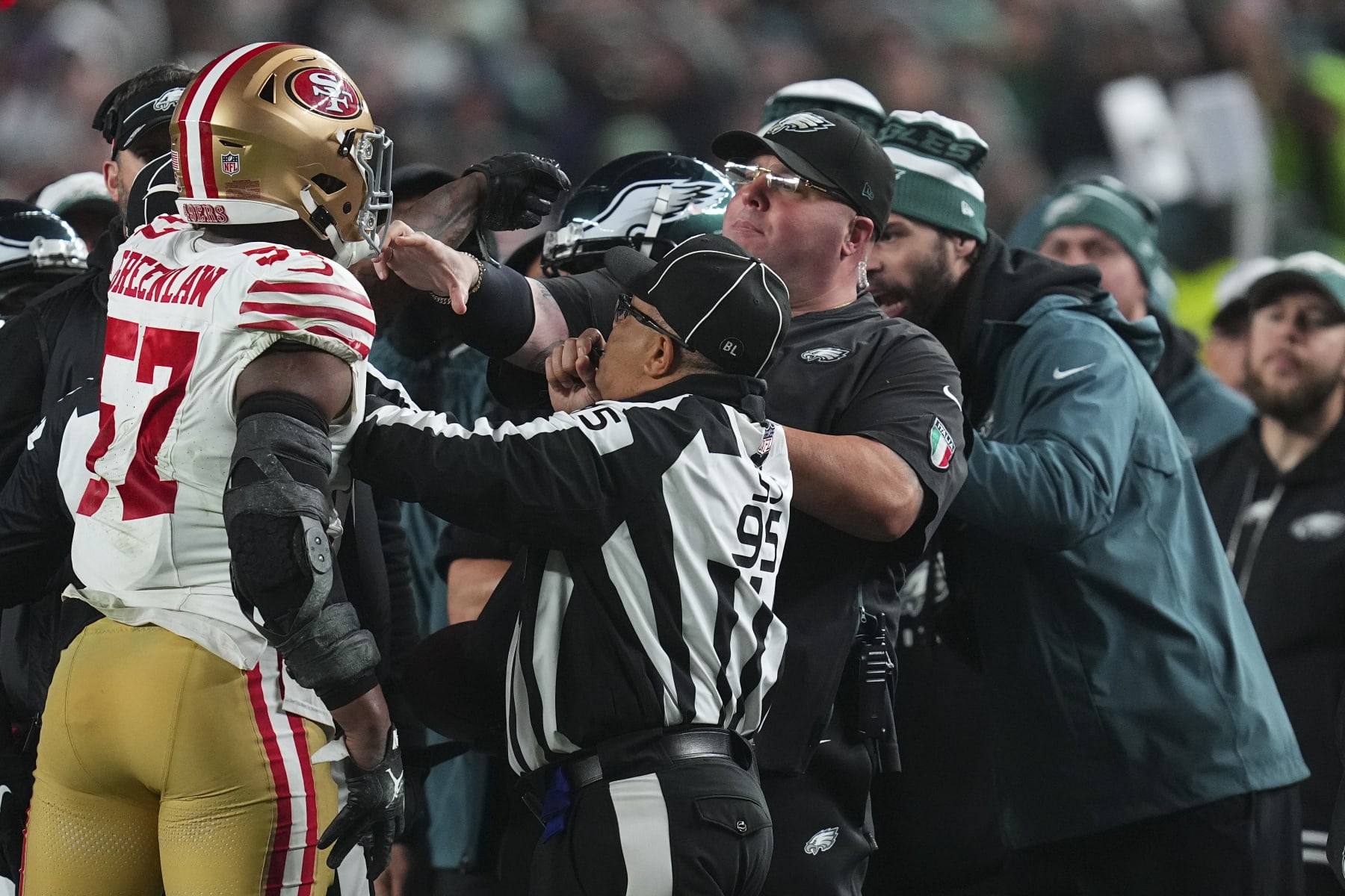 PHILADELPHIA, PENNSYLVANIA - DECEMBER 3: Dre Greenlaw #57 of the San Francisco 49ers gets into an altercation with head of security Dom DiSandro of the Philadelphia Eagles at Lincoln Financial Field on December 3, 2023 in Philadelphia, Pennsylvania. (Photo by Mitchell Leff/Getty Images)