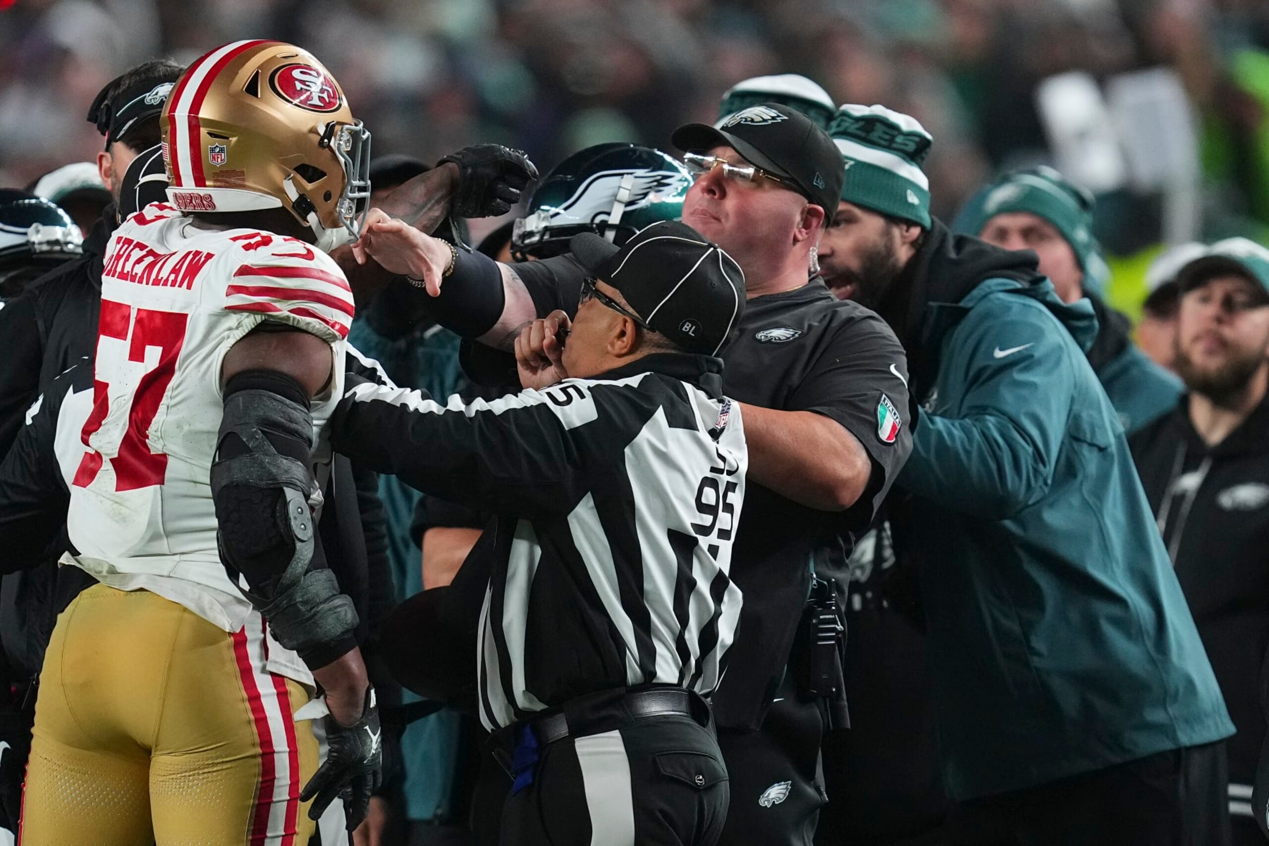 PHILADELPHIA, PENNSYLVANIA - DECEMBER 3: Dre Greenlaw #57 of the San Francisco 49ers gets into an altercation with head of security Dom DiSandro of the Philadelphia Eagles at Lincoln Financial Field on December 3, 2023 in Philadelphia, Pennsylvania. (Photo by Mitchell Leff/Getty Images)