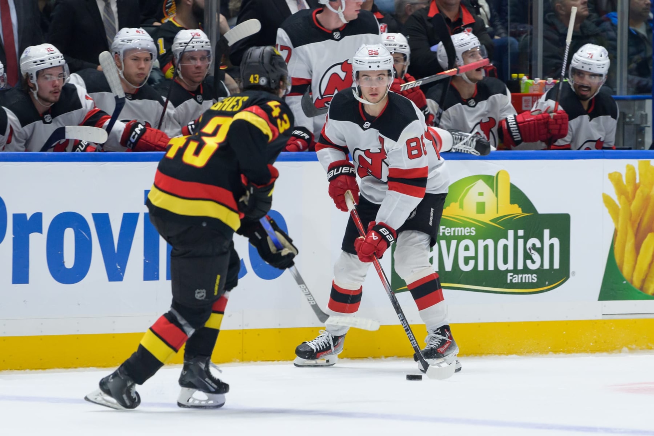 VANCOUVER, CANADA - DECEMBER 5: Quinn Hughes #43 of the Vancouver Canucks defends Jack Hughes #86 of the New Jersey Devils during the second period of their NHL game at Rogers Arena on December 5, 2023 in Vancouver, British Columbia, Canada. (Photo by Derek Cain/Getty Images)