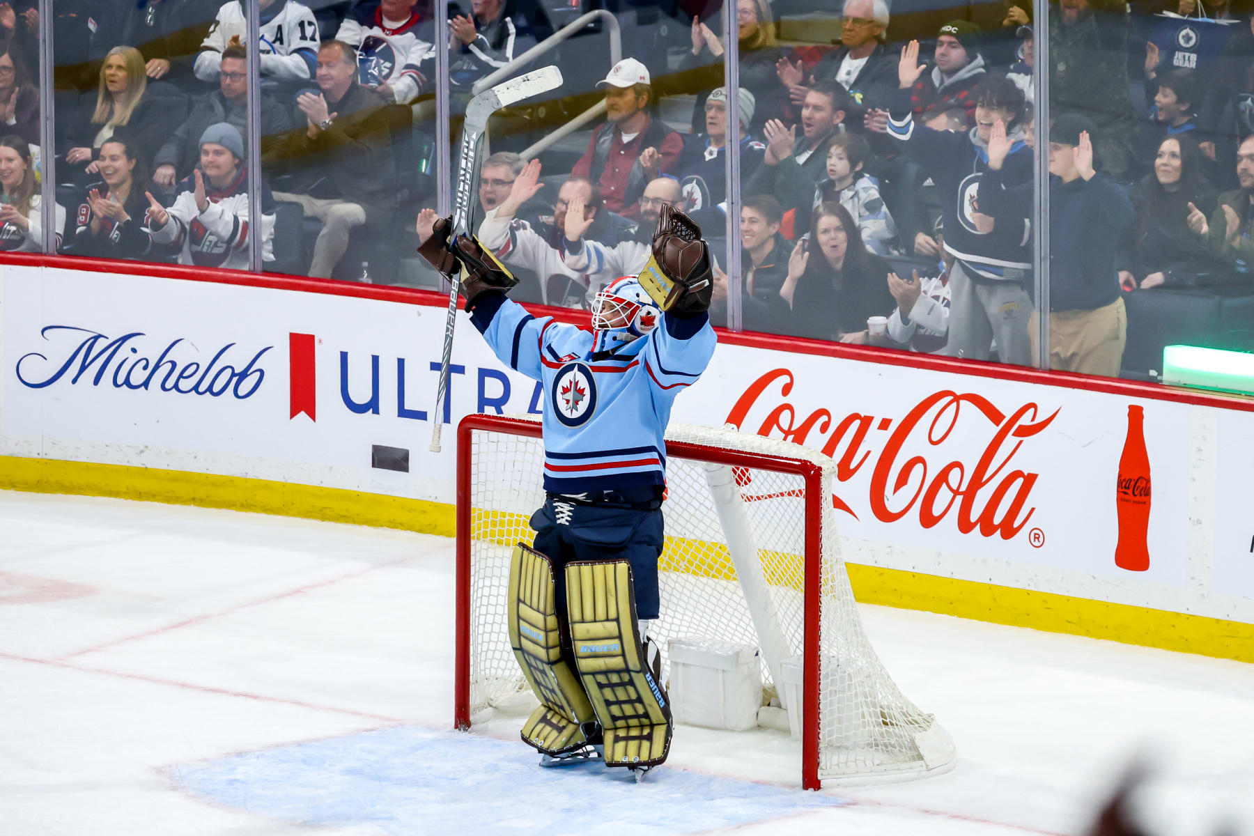 WINNIPEG, CANADA - DECEMBER 4: Goaltender Laurent Brossoit #39 of the Winnipeg Jets celebrates following a 2-1 victory over the Carolina Hurricanes at the Canada Life Centre on December 4, 2023 in Winnipeg, Manitoba, Canada. (Photo by Jonathan Kozub/NHLI via Getty Images)