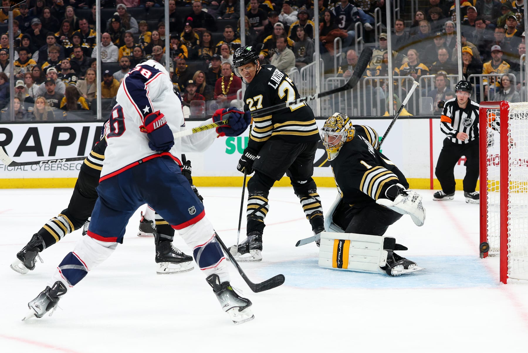 BOSTON, MA - DECEMBER 03: Columbus Blue Jackets center Boone Jenner (38) scores a goal against Boston Bruins goalie Jeremy Swayman (1) during the NHL game between Columbus Blue Jackets and Boston Bruins on December 3, 2023, at TD Garden in Boston, MA. (Photo by M. Anthony Nesmith/Icon Sportswire via Getty Images)