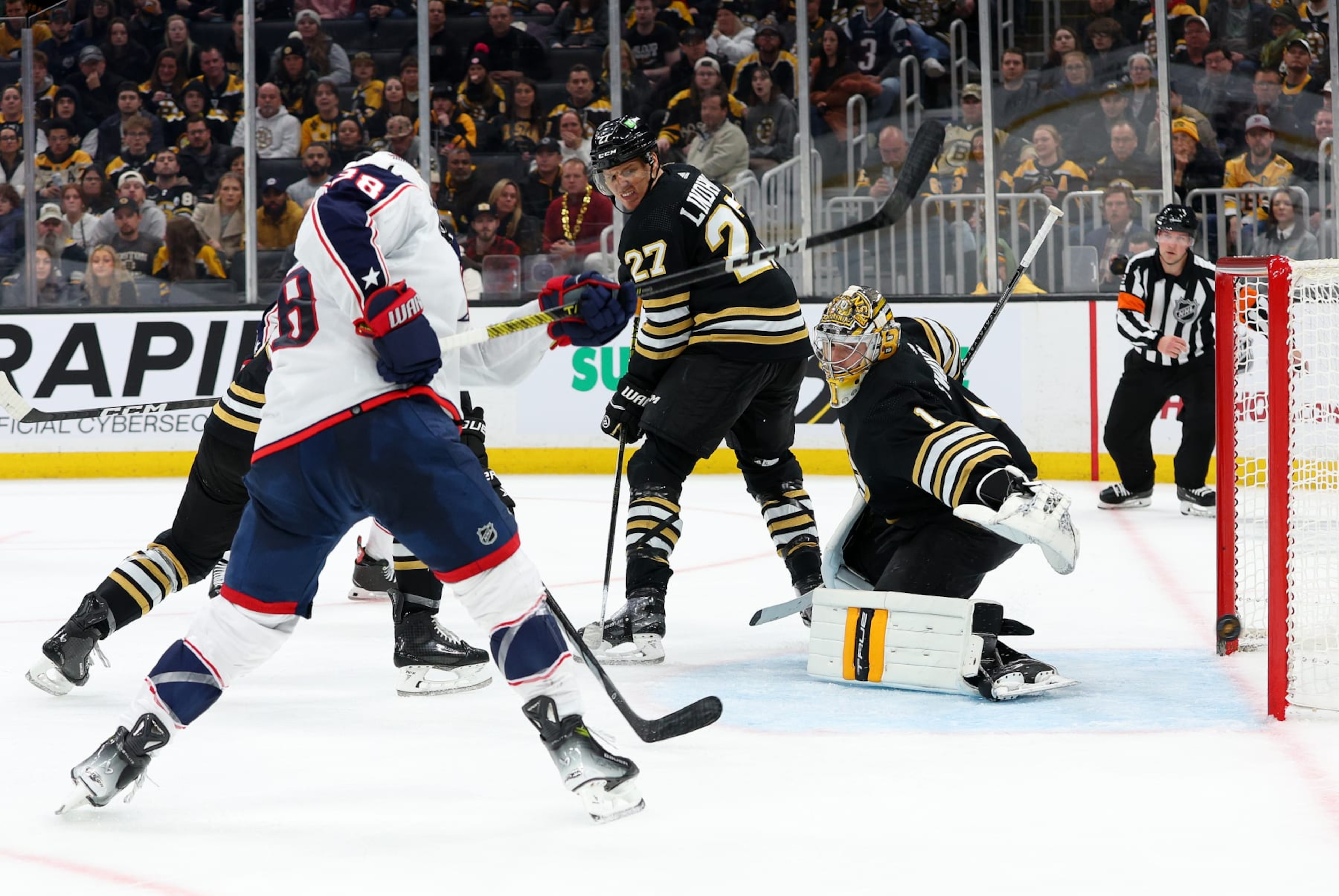 BOSTON, MA - DECEMBER 03: Columbus Blue Jackets center Boone Jenner (38) scores a goal against Boston Bruins goalie Jeremy Swayman (1) during the NHL game between Columbus Blue Jackets and Boston Bruins on December 3, 2023, at TD Garden in Boston, MA. (Photo by M. Anthony Nesmith/Icon Sportswire via Getty Images) BOSTON, MA - DECEMBER 03: Columbus Blue Jackets center Boone Jenner (38) scores a goal against Boston Bruins goalie Jeremy Swayman (1) during the NHL game between Columbus Blue Jackets and Boston Bruins on December 3, 2023, at TD Garden in Boston, MA. (Photo by M. Anthony Nesmith/Icon Sportswire via Getty Images)