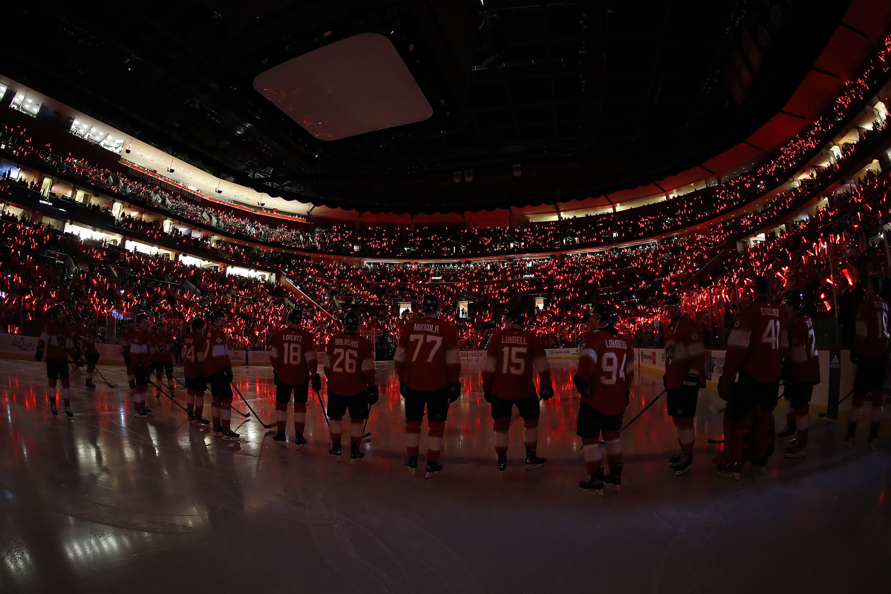 SUNRISE, FLORIDA - OCTOBER 19: The Florida Panthers stand on the ice to the cheers from the home crowd prior to the start of the game against the Toronto Maple Leafs at the Amerant Bank Arena on October 19, 2023 in Sunrise, Florida. (Photo by Eliot J. Schechter/NHLI via Getty Images)