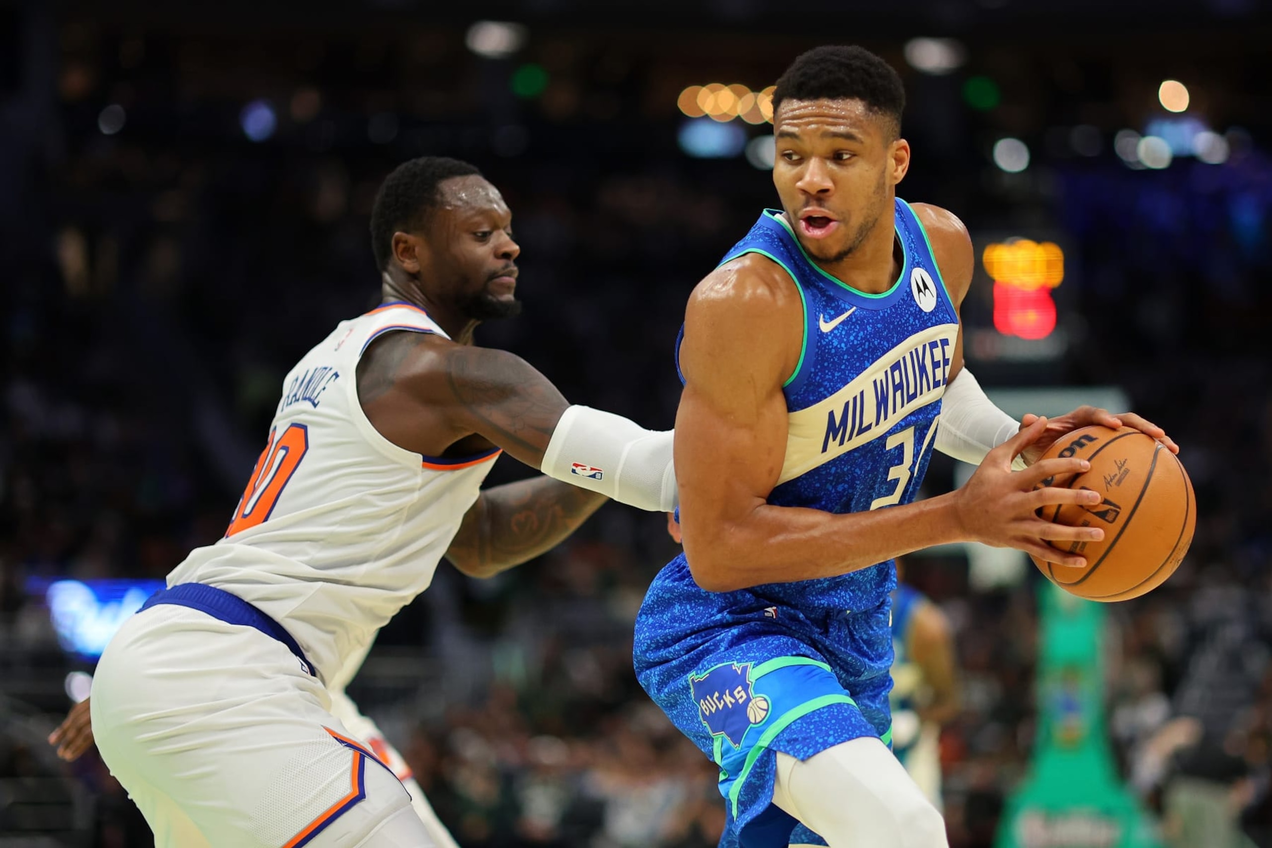 MILWAUKEE, WISCONSIN - DECEMBER 05: Giannis Antetokounmpo #34 of the Milwaukee Bucks is defended by Julius Randle #30 of the New York Knicks during the first half of the NBA In-Season Tournament Quarterfinal at Fiserv Forum on December 05, 2023 in Milwaukee, Wisconsin. NOTE TO USER: User expressly acknowledges and agrees that, by downloading and or using this photograph, User is consenting to the terms and conditions of the Getty Images License Agreement. (Photo by Stacy Revere/Getty Images)