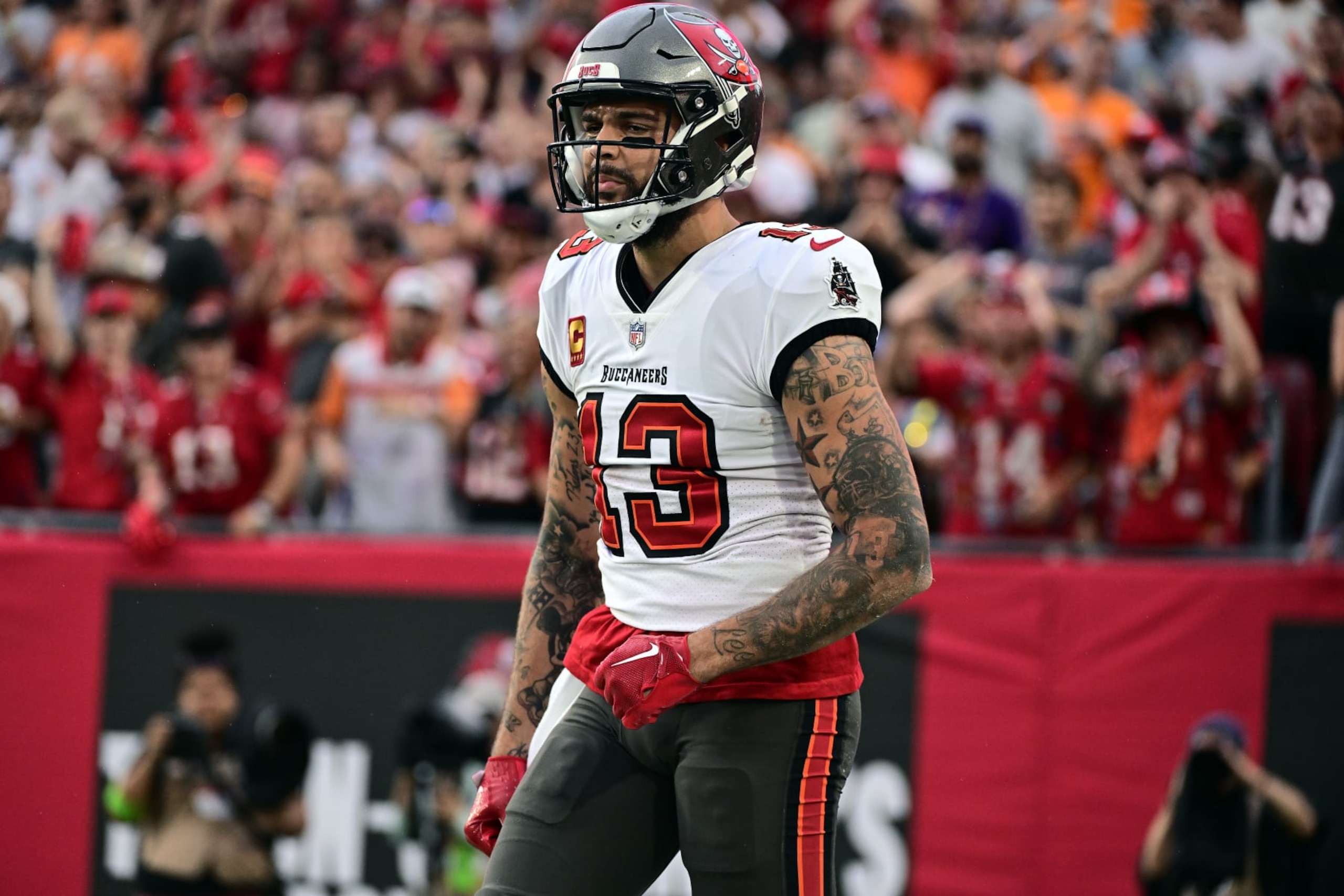TAMPA, FLORIDA - DECEMBER 03: Mike Evans #13 of the Tampa Bay Buccaneers reacts after a reception against the Carolina Panthers during the first quarter at Raymond James Stadium on December 03, 2023 in Tampa, Florida. (Photo by Julio Aguilar/Getty Images)