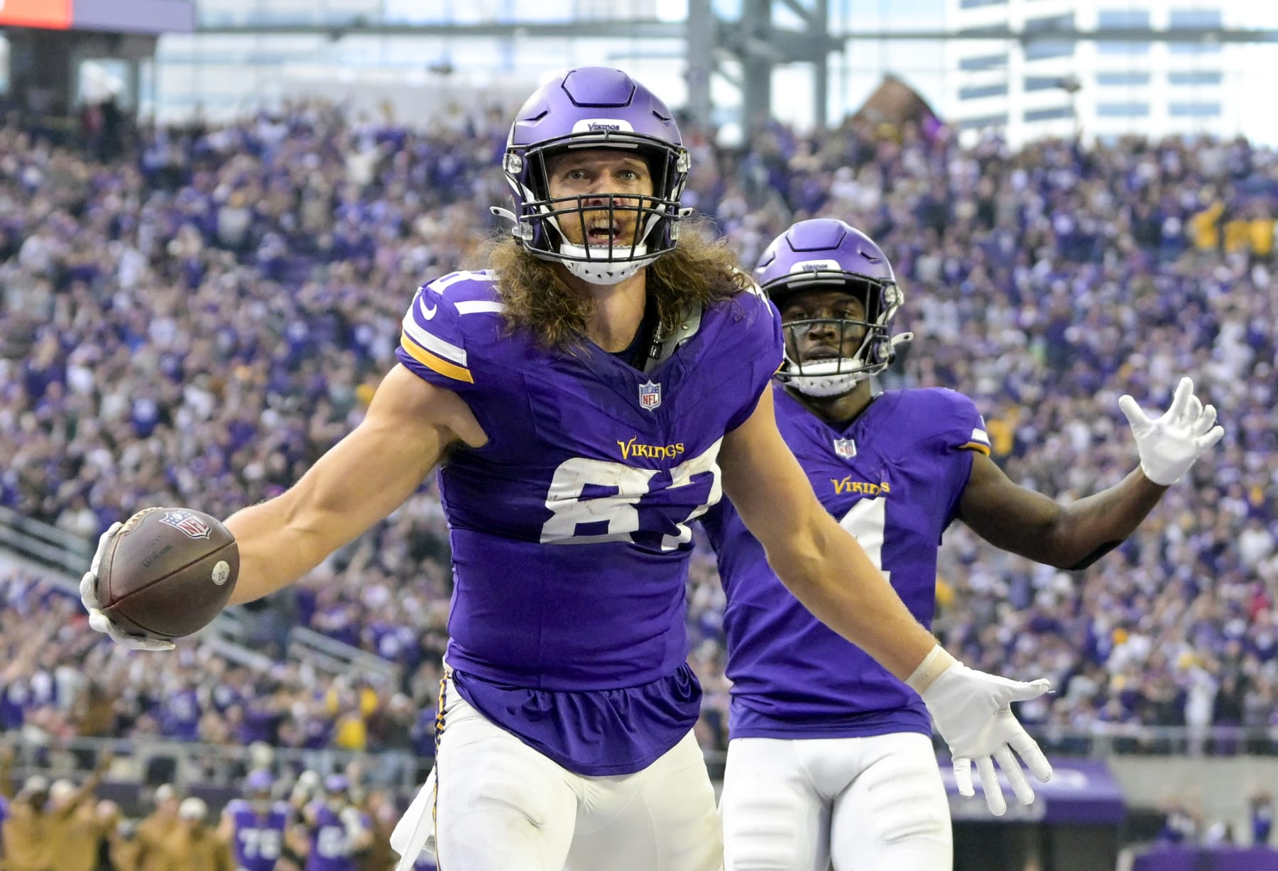 MINNEAPOLIS, MN - NOVEMBER 12: Minnesota Vikings tight end T.J. Hockenson (87) celebrates his 28-yard touchdown reception during the second quarter of an NFL game between the Minnesota Vikings and New Orleans Saints on November 12, 2023, at U.S. Bank Stadium in Minneapolis, MN. (Photo by Nick Wosika/Icon Sportswire via Getty Images)