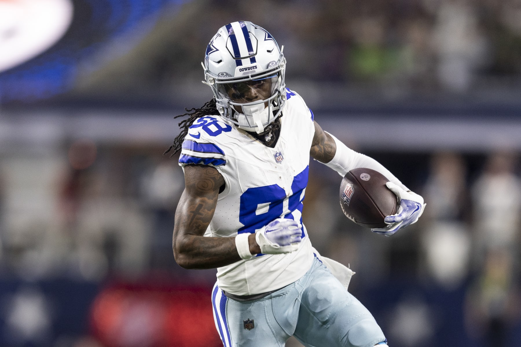 ARLINGTON, TEXAS - NOVEMBER 30: CeeDee Lamb #88 of the Dallas Cowboys runs with the ball during an NFL football game between the Dallas Cowboys and the Seattle Seahawks at AT&T Stadium on November 30, 2023 in Arlington, Texas. (Photo by Michael Owens/Getty Images)