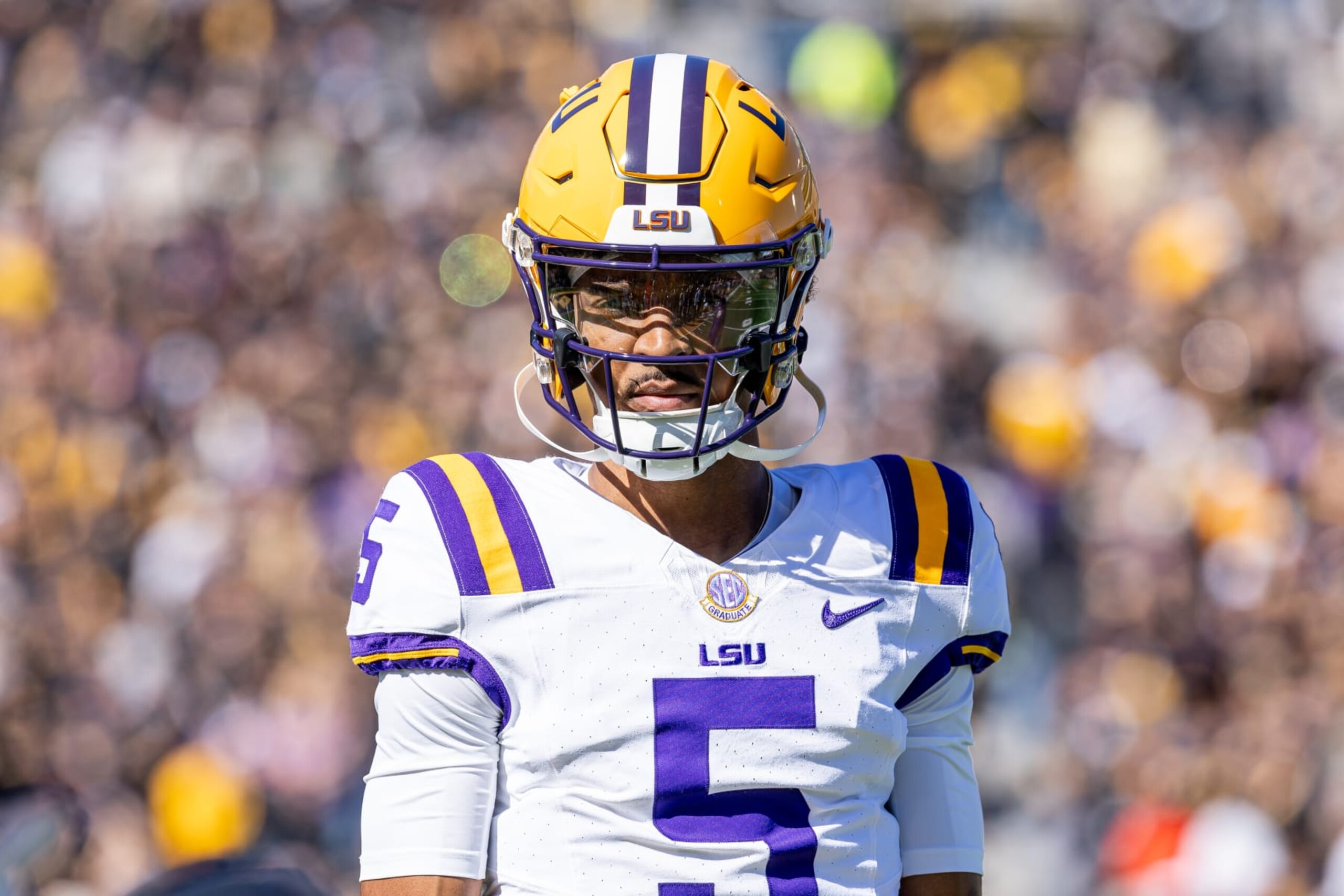 COLUMBIA, MISSOURI - OCTOBER 7: Jayden Daniels #5 of the LSU Tigers warms up during a timeout against the Missouri Tigers at Faurot Field/Memorial Stadium on October 7, 2023 in Columbia, Missouri. (Photo by Michael Hickey/Getty Images) COLUMBIA, MISSOURI - OCTOBER 7: Jayden Daniels #5 of the LSU Tigers warms up during a timeout against the Missouri Tigers at Faurot Field/Memorial Stadium on October 7, 2023 in Columbia, Missouri. (Photo by Michael Hickey/Getty Images)