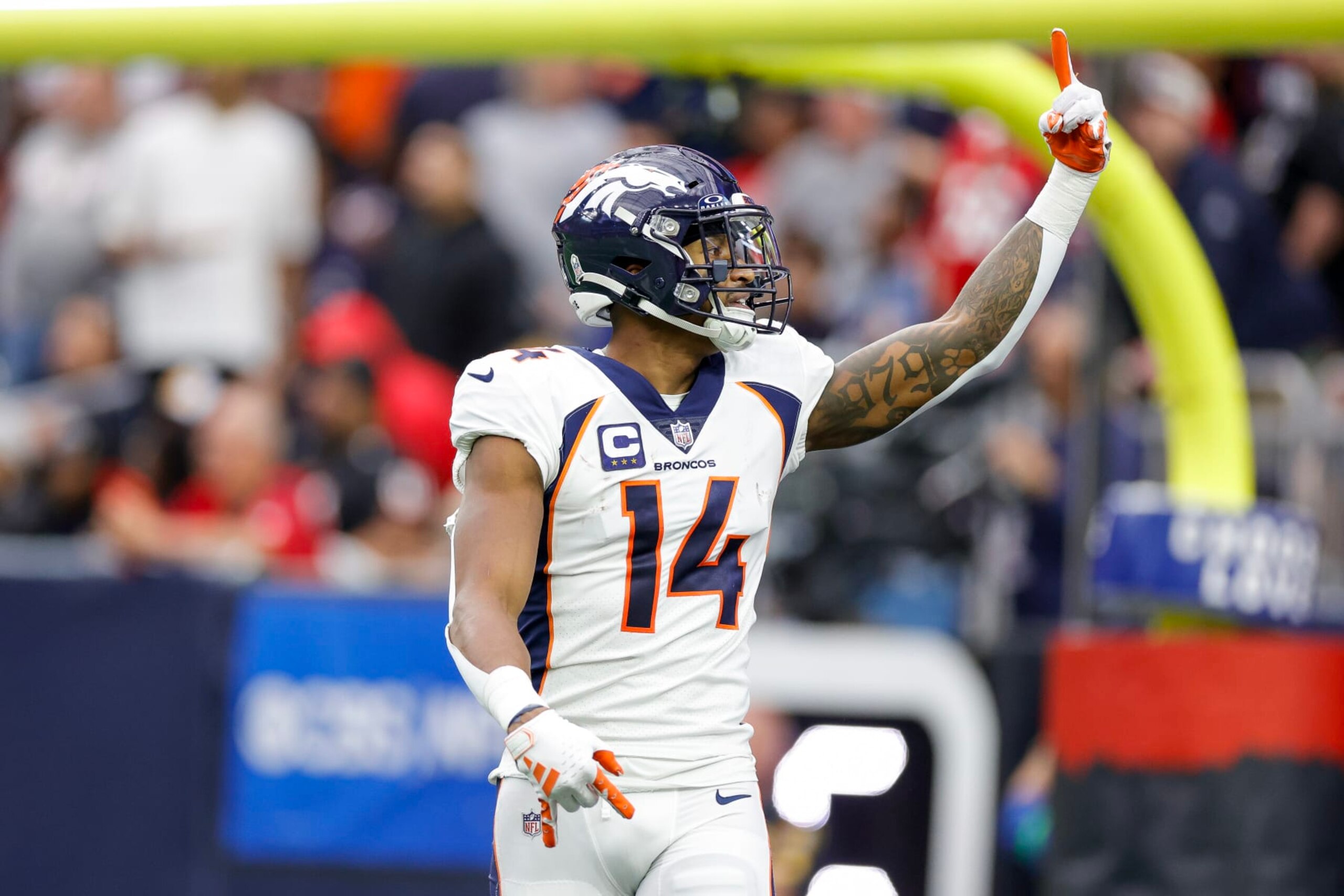 HOUSTON, TEXAS - DECEMBER 03: Courtland Sutton #14 of the Denver Broncos celebrates after scoring a touchdown in the third quarter against the Houston Texans at NRG Stadium on December 03, 2023 in Houston, Texas. (Photo by Carmen Mandato/Getty Images)
