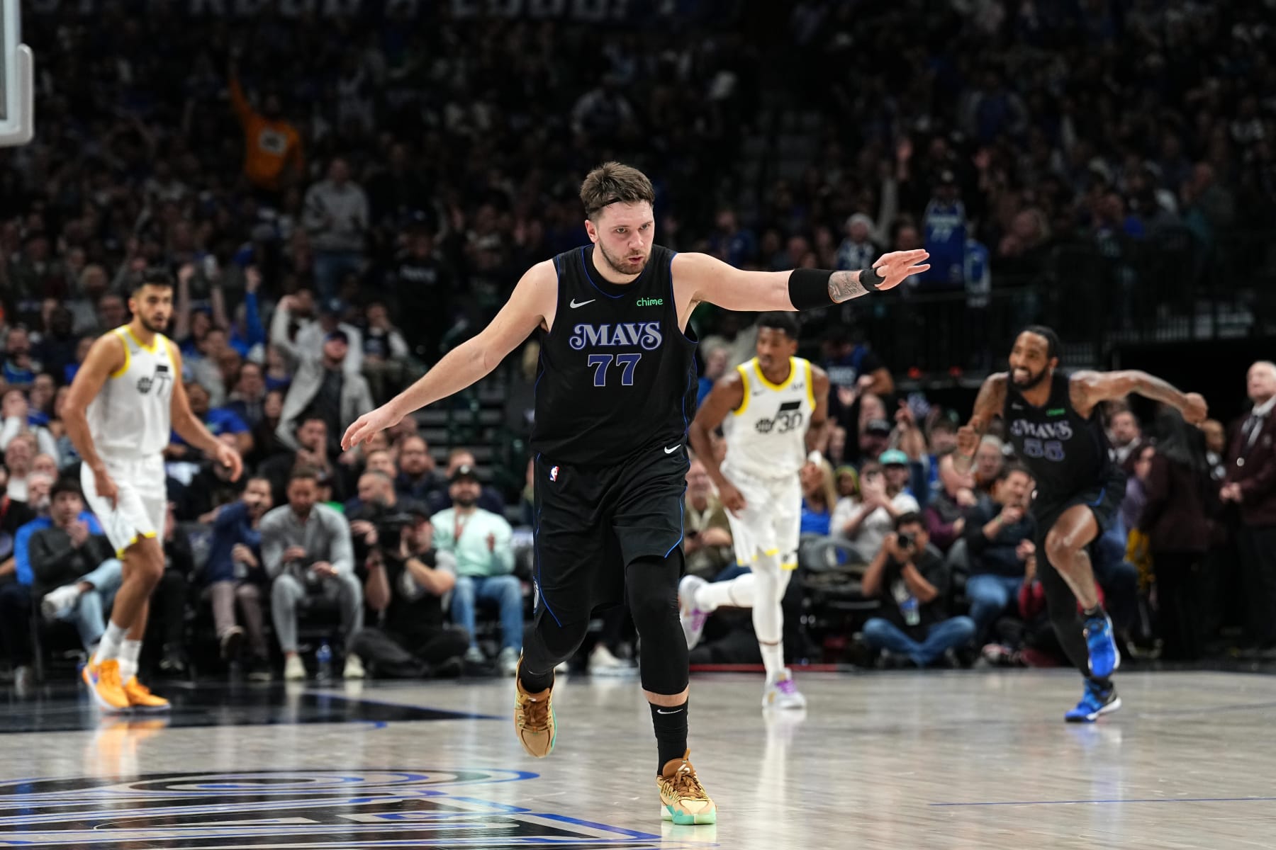 DALLAS, TX - DECEMBER 6 : Luka Doncic #77 of the Dallas Mavericks celebrates during the game against the Utah Jazz on December 6, 2023 at the American Airlines Center in Dallas, Texas. NOTE TO USER: User expressly acknowledges and agrees that, by downloading and or using this photograph, User is consenting to the terms and conditions of the Getty Images License Agreement. Mandatory Copyright Notice: Copyright 2023 NBAE (Photo by Glenn James/NBAE via Getty Images)