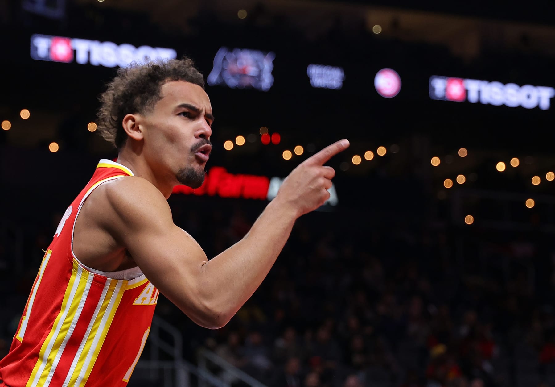 ATLANTA, GEORGIA - DECEMBER 06:  Trae Young #11 of the Atlanta Hawks reacts after drawing a foul on a basket against the Brooklyn Nets during the first quarter at State Farm Arena on December 06, 2023 in Atlanta, Georgia.  NOTE TO USER: User expressly acknowledges and agrees that, by downloading and/or using this photograph, user is consenting to the terms and conditions of the Getty Images License Agreement.  (Photo by Kevin C. Cox/Getty Images)