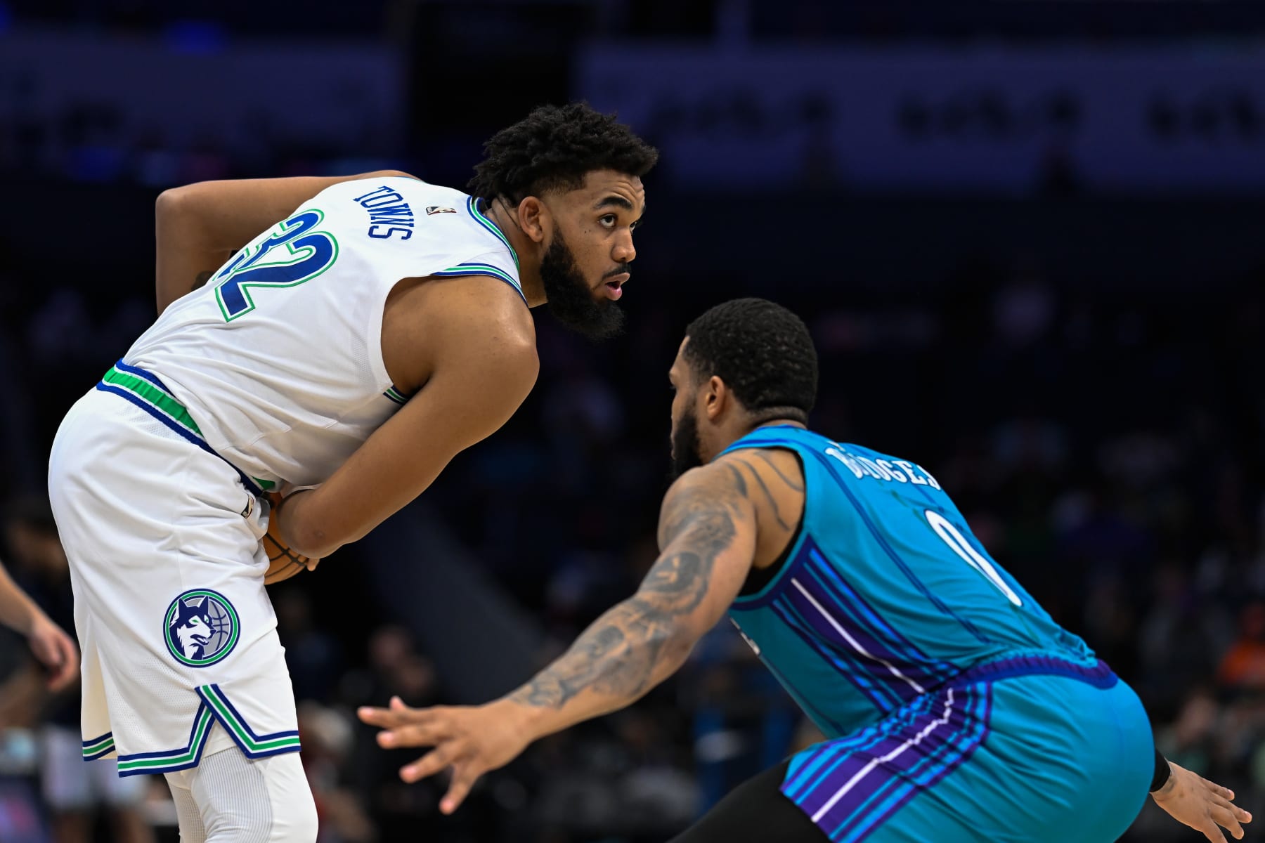 CHARLOTTE, NORTH CAROLINA - DECEMBER 02: Karl-Anthony Towns #32 of the Minnesota Timberwolves is defended by Miles Bridges #0 of the Charlotte Hornets during the second half of their game at Spectrum Center on December 02, 2023 in Charlotte, North Carolina. NOTE TO USER: User expressly acknowledges and agrees that, by downloading and or using this photograph, User is consenting to the terms and conditions of the Getty Images License Agreement.   (Photo by Matt Kelley/Getty Images)