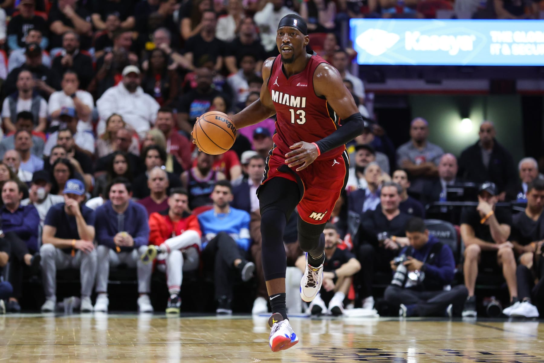 MIAMI, FLORIDA - NOVEMBER 30: Bam Adebayo #13 of the Miami Heat dribbles the ball against the Indiana Pacers during the second quarter of the game at Kaseya Center on November 30, 2023 in Miami, Florida. NOTE TO USER: User expressly acknowledges and agrees that, by downloading and or using this photograph, User is consenting to the terms and conditions of the Getty Images License Agreement. (Photo by Megan Briggs/Getty Images)