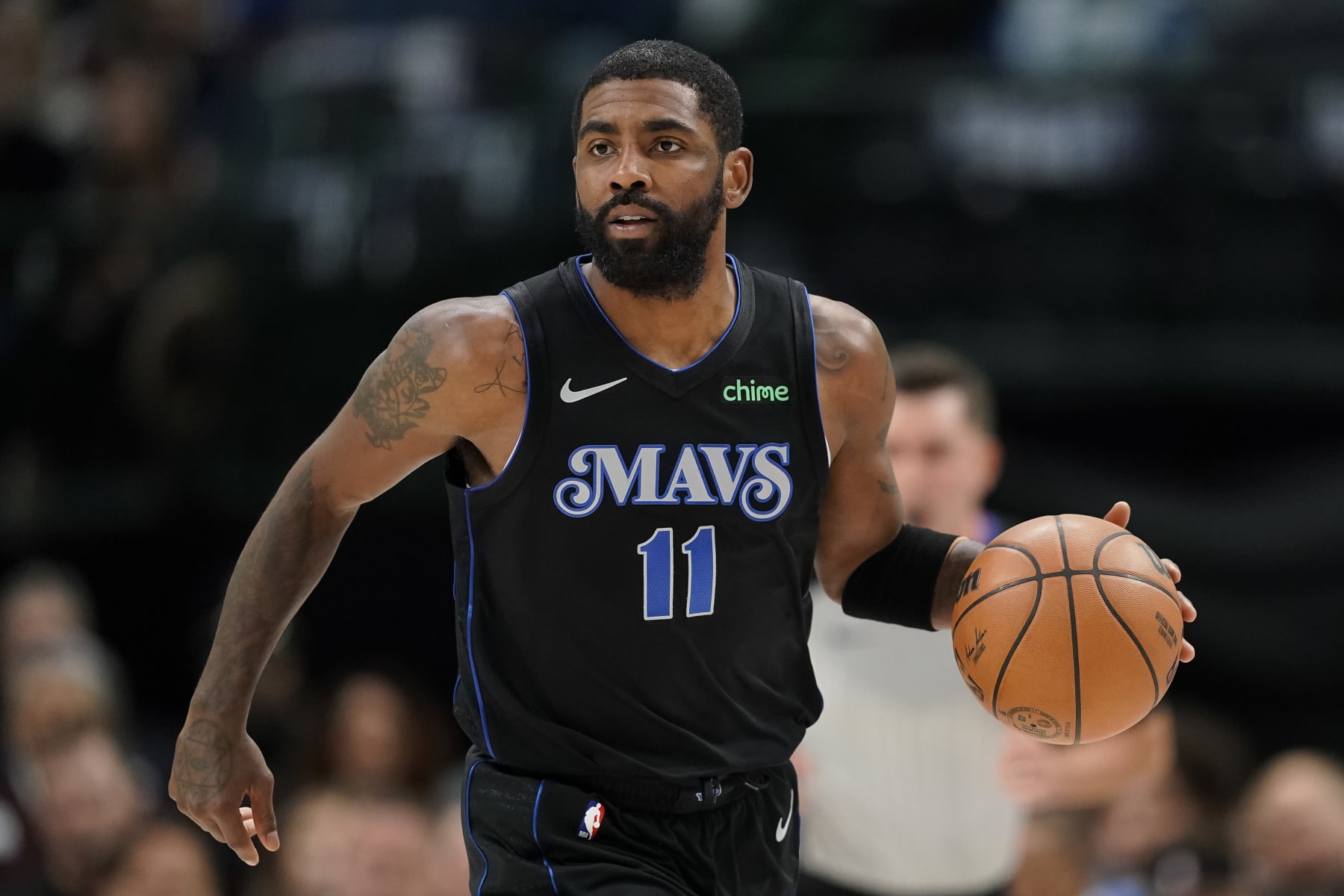 DALLAS, TEXAS - DECEMBER 06: Kyrie Irving #11 of the Dallas Mavericks brings the ball downcourt during the first half against the Utah Jazz at American Airlines Center on December 06, 2023 in Dallas, Texas. NOTE TO USER: User expressly acknowledges and agrees that, by downloading and/or using this Photograph, user is consenting to the terms and conditions of the Getty Images License Agreement. (Photo by Sam Hodde/Getty Images)
