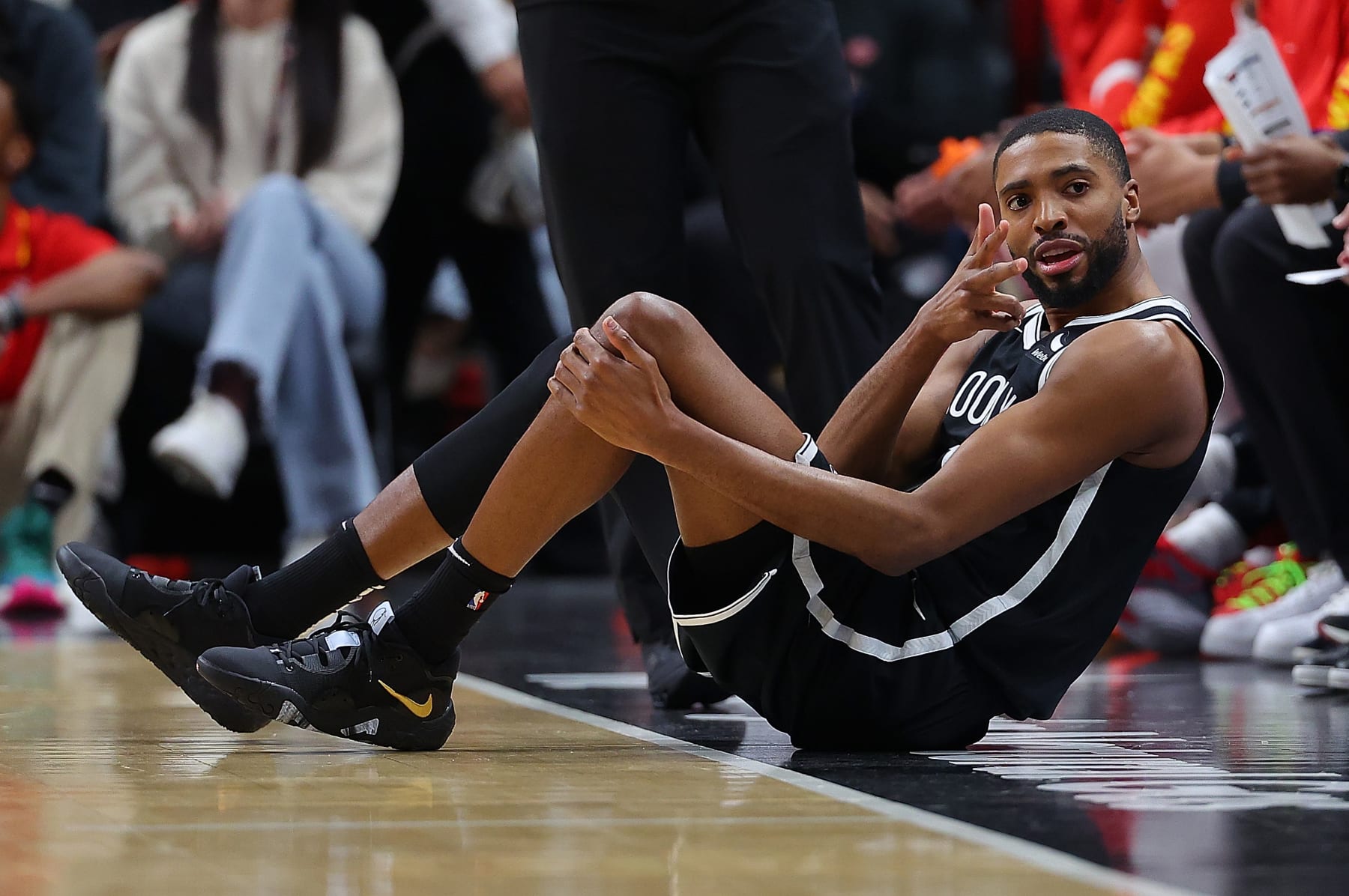 ATLANTA, GEORGIA - DECEMBER 06:  Mikal Bridges #1 of the Brooklyn Nets reacts after drawing a foul on a three-point basket against the Atlanta Hawks during the first quarter at State Farm Arena on December 06, 2023 in Atlanta, Georgia.  NOTE TO USER: User expressly acknowledges and agrees that, by downloading and/or using this photograph, user is consenting to the terms and conditions of the Getty Images License Agreement.  (Photo by Kevin C. Cox/Getty Images)
