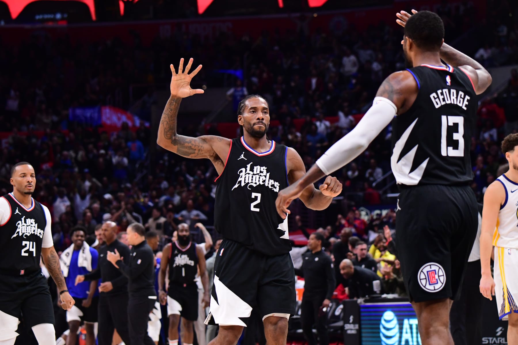 LOS ANGELES, CA - DECEMBER 2:  Kawhi Leonard #2 high fives  Paul George #13 of the LA Clippers during the game against the Golden State Warriors on December 2, 2023 at Crypto.Com Arena in Los Angeles, California. NOTE TO USER: User expressly acknowledges and agrees that, by downloading and/or using this Photograph, user is consenting to the terms and conditions of the Getty Images License Agreement. Mandatory Copyright Notice: Copyright 2023 NBAE (Photo by Adam Pantozzi/NBAE via Getty Images)