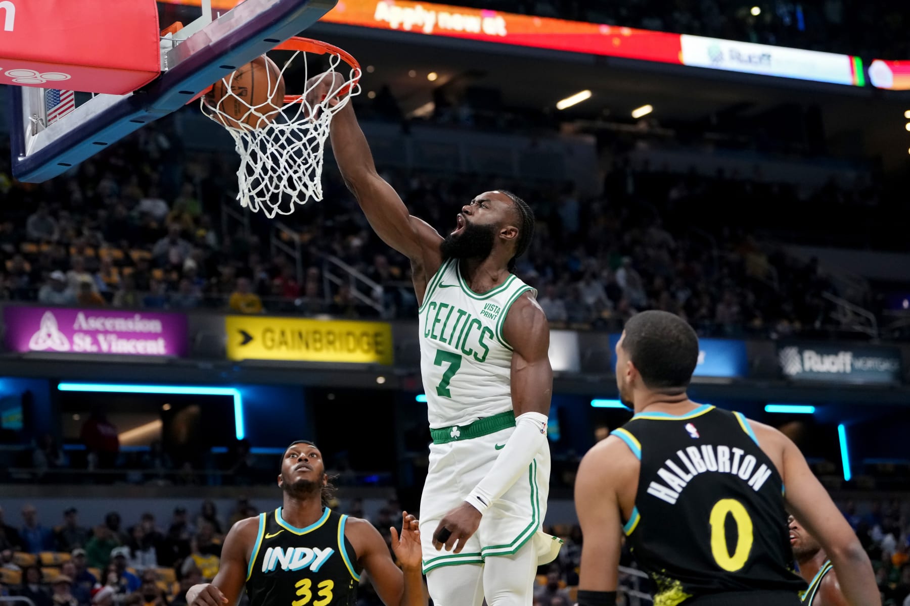 INDIANAPOLIS, INDIANA - DECEMBER 04: Jaylen Brown #7 of the Boston Celtics dunks the ball past Myles Turner #33 and Tyrese Haliburton #0 of the Indiana Pacers in the first quarter during the NBA In-Season Tournament at Gainbridge Fieldhouse on December 04, 2023 in Indianapolis, Indiana. NOTE TO USER: User expressly acknowledges and agrees that, by downloading and or using this photograph, User is consenting to the terms and conditions of the Getty Images License Agreement. (Photo by Dylan Buell/Getty Images)