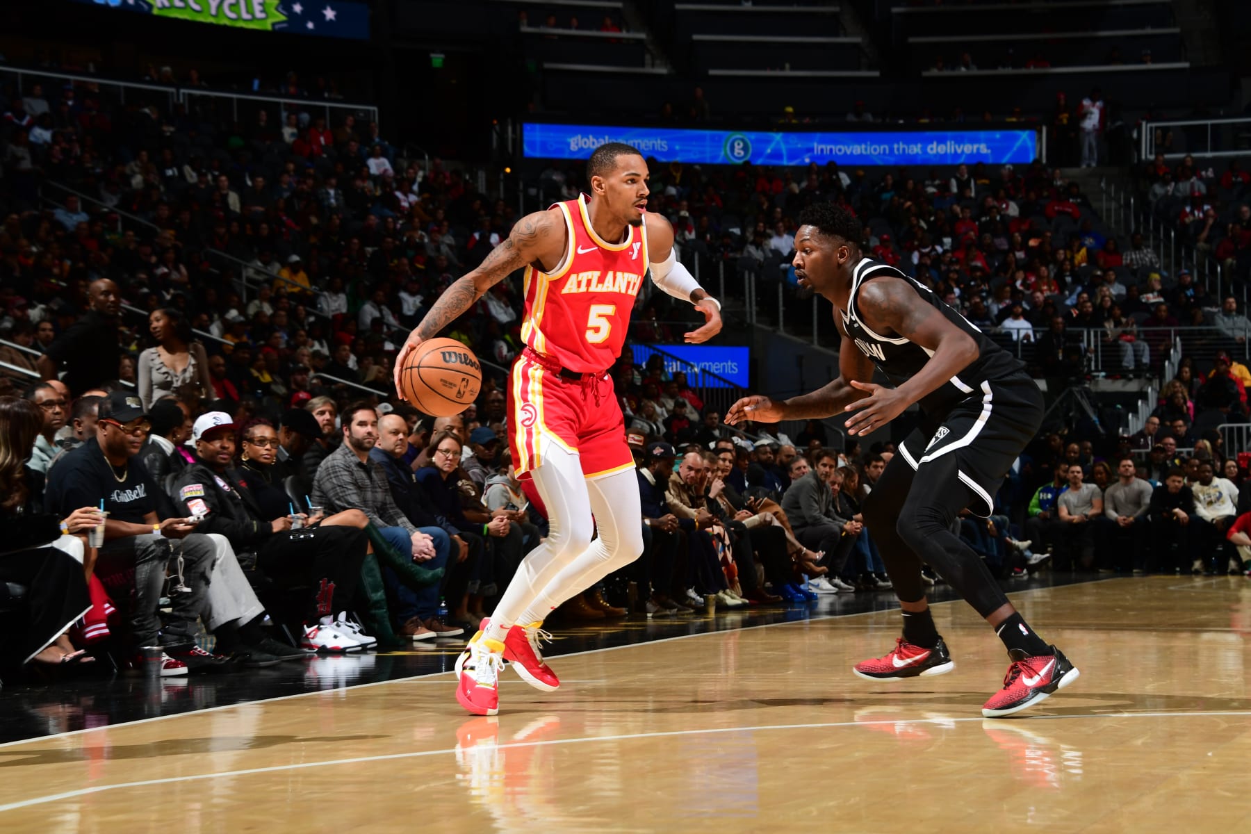 ATLANTA, GA - DECEMBER 6: Dejounte Murray #5 of the Atlanta Hawks handles the ball during the game against the Brooklyn Nets on December 6, 2023 at State Farm Arena in Atlanta, Georgia.  NOTE TO USER: User expressly acknowledges and agrees that, by downloading and/or using this Photograph, user is consenting to the terms and conditions of the Getty Images License Agreement. Mandatory Copyright Notice: Copyright 2023 NBAE (Photo by Scott Cunningham/NBAE via Getty Images)