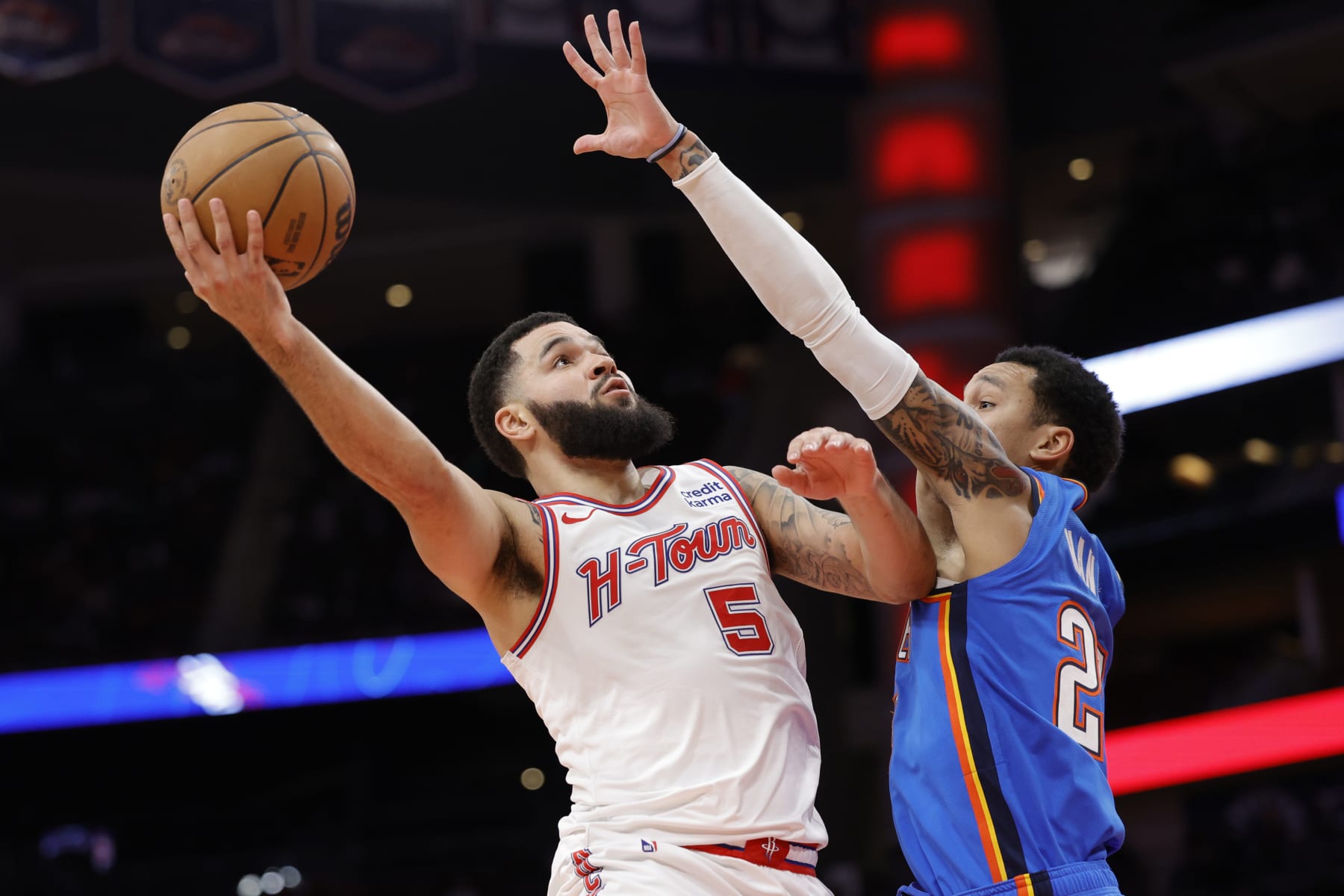 HOUSTON, TEXAS - DECEMBER 06: Fred VanVleet #5 of the Houston Rockets drives to the net against Tre Mann #23 of the Oklahoma City Thunder during the second half at Toyota Center on December 06, 2023 in Houston, Texas. NOTE TO USER: User expressly acknowledges and agrees that, by downloading and or using this photograph, User is consenting to the terms and conditions of the Getty Images License Agreement.  (Photo by Carmen Mandato/Getty Images)