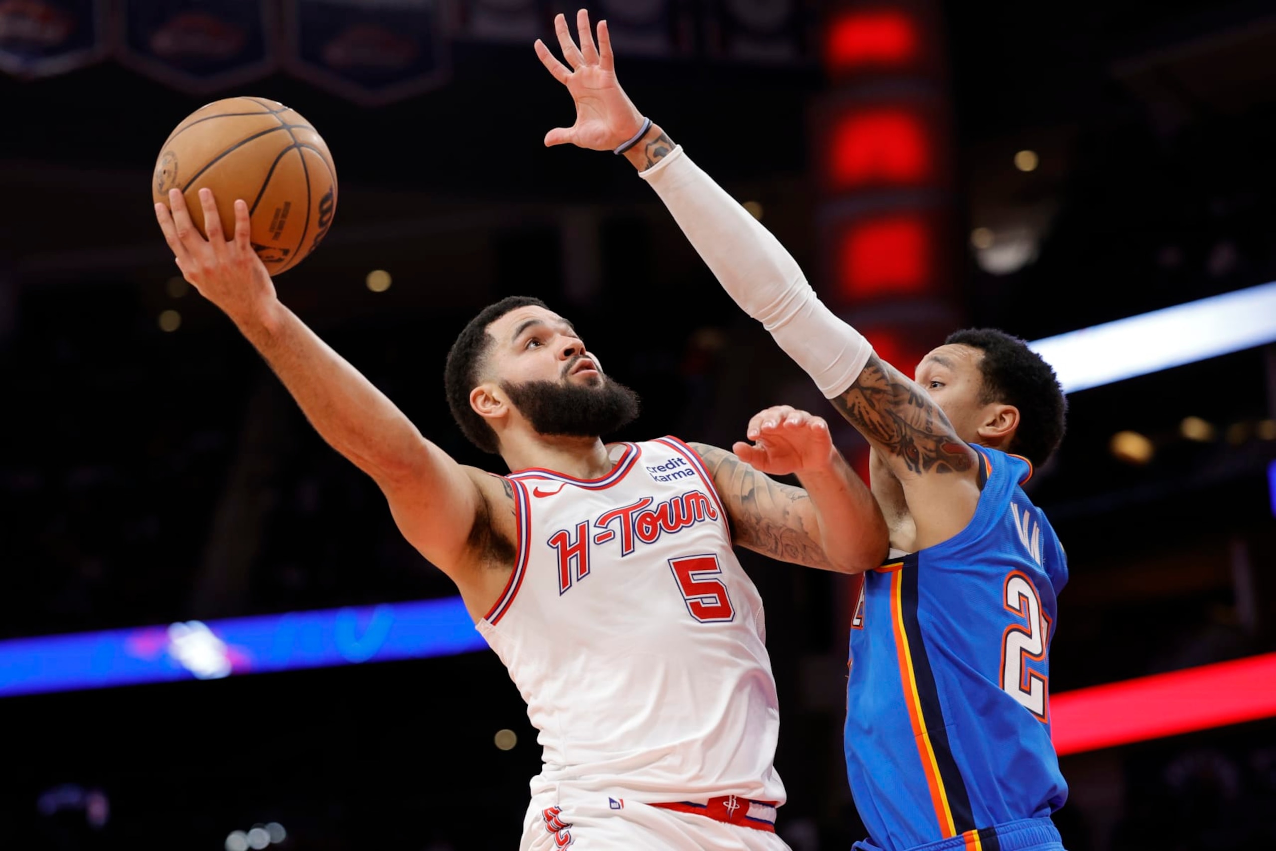 HOUSTON, TEXAS - DECEMBER 06: Fred VanVleet #5 of the Houston Rockets drives to the net against Tre Mann #23 of the Oklahoma City Thunder during the second half at Toyota Center on December 06, 2023 in Houston, Texas. NOTE TO USER: User expressly acknowledges and agrees that, by downloading and or using this photograph, User is consenting to the terms and conditions of the Getty Images License Agreement.  (Photo by Carmen Mandato/Getty Images)