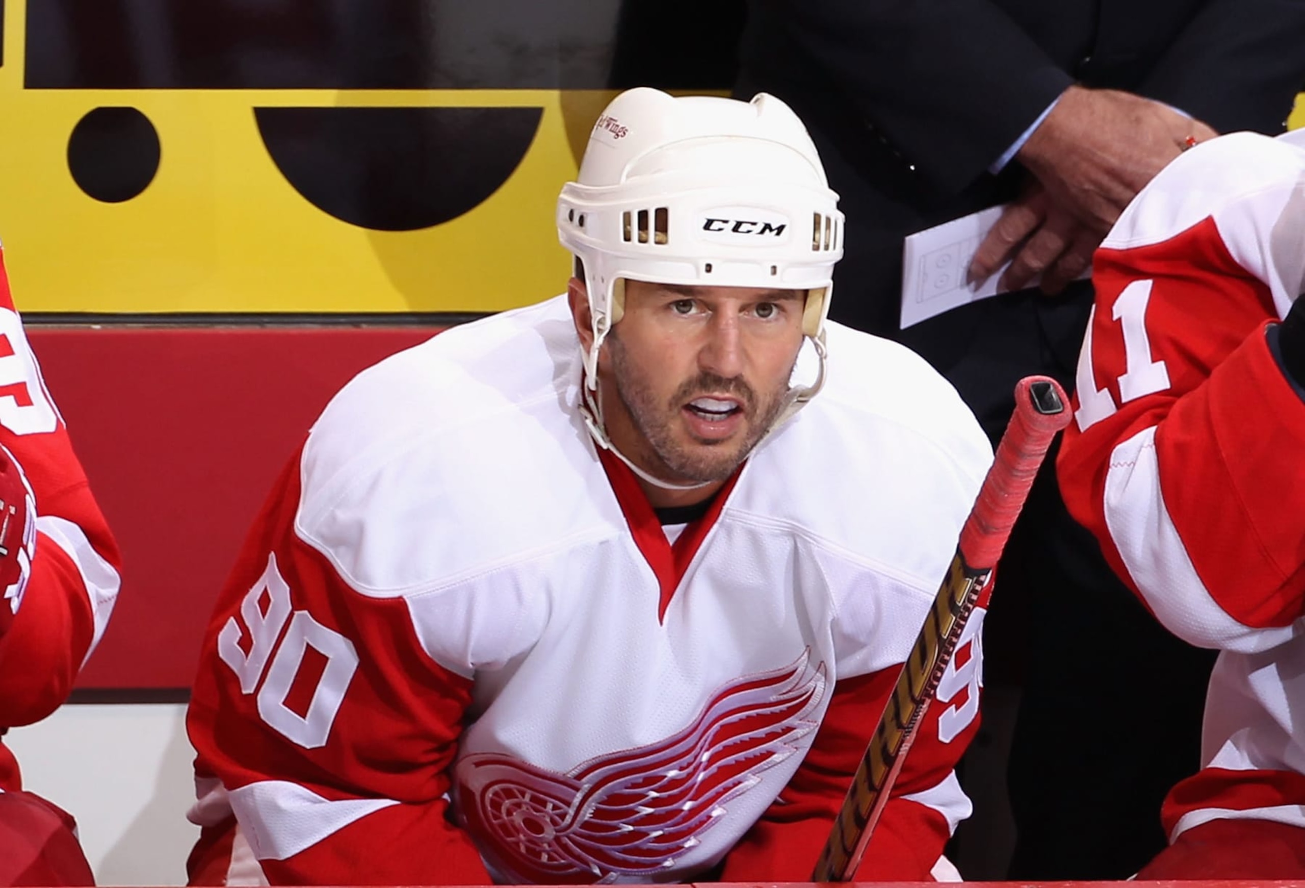 GLENDALE, AZ - OCTOBER 16:  Mike Modano #90 of the Detroit Red Wings watches from the bench during the NHL game against the Phoenix Coyotes at Jobing.com Arena on October16, 2010 in Glendale, Arizona.  The Red Wings defeated the Coyotes 2-1 in overtime.  (Photo by Christian Petersen/Getty Images)