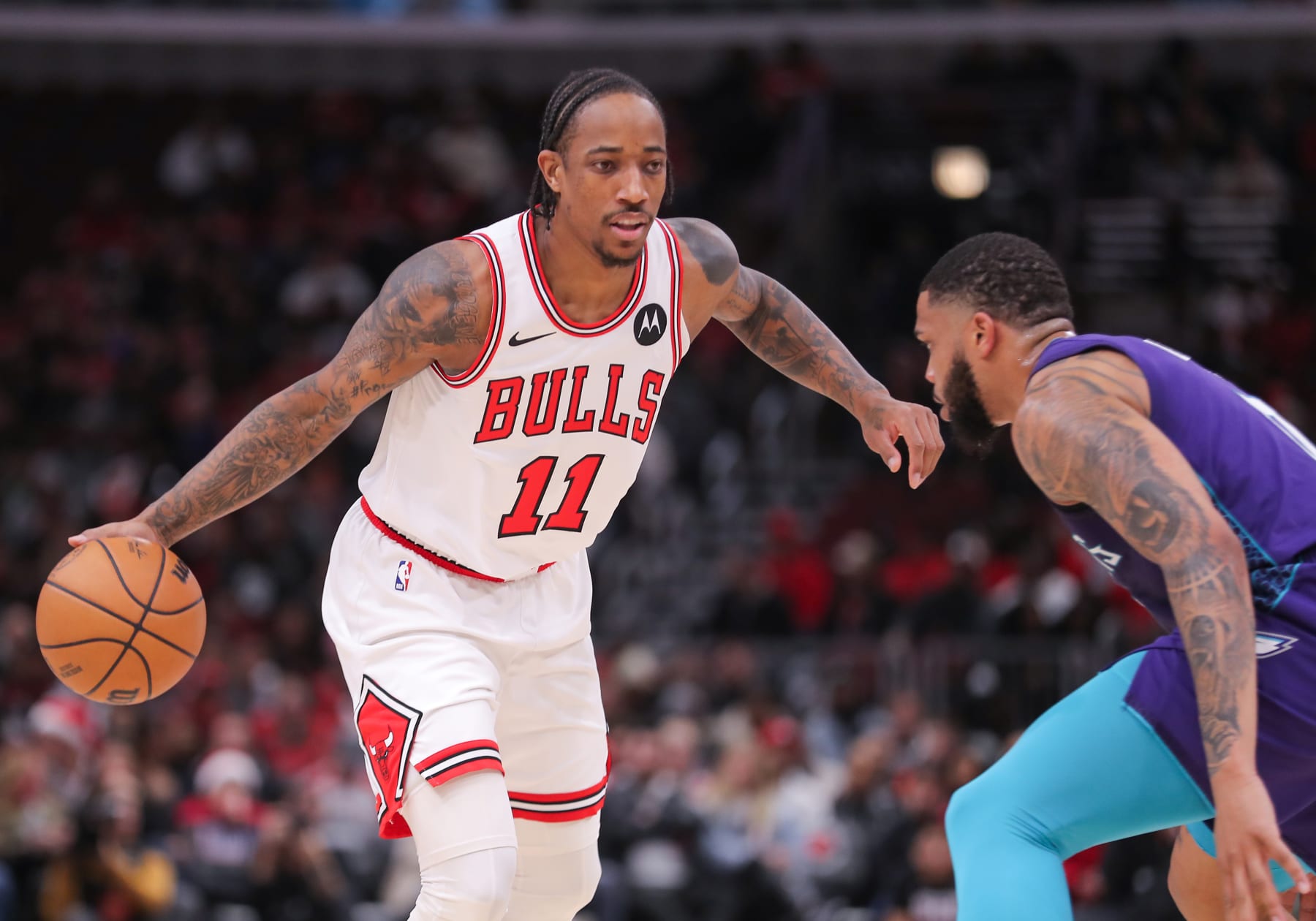 CHICAGO, IL - DECEMBER 06: DeMar DeRozan #11 of the Chicago Bulls dribbles the ball during the first half against Charlotte Hornets at the United Center on December 6, 2023 in Chicago, Illinois. (Photo by Melissa Tamez/Icon Sportswire via Getty Images)