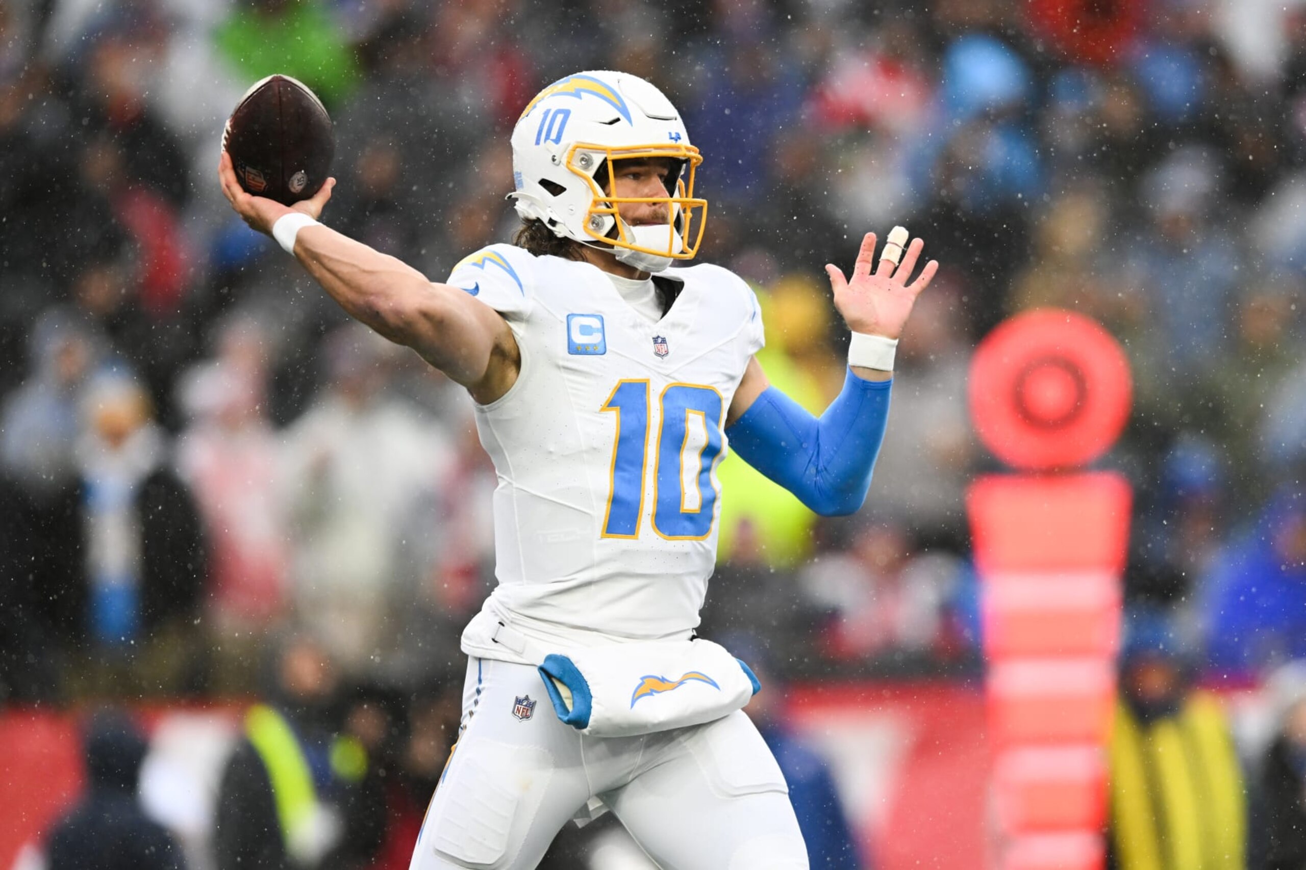 FOXBORO, MA - DECEMBER 3: Justin Herbert #10 of the Los Angeles Chargers looks to throw the football during the first half against the New England Patriots at Gillette Stadium on December 3, 2023 in Foxboro, Massachusetts. (Photo by Kathryn Riley/Getty Images)