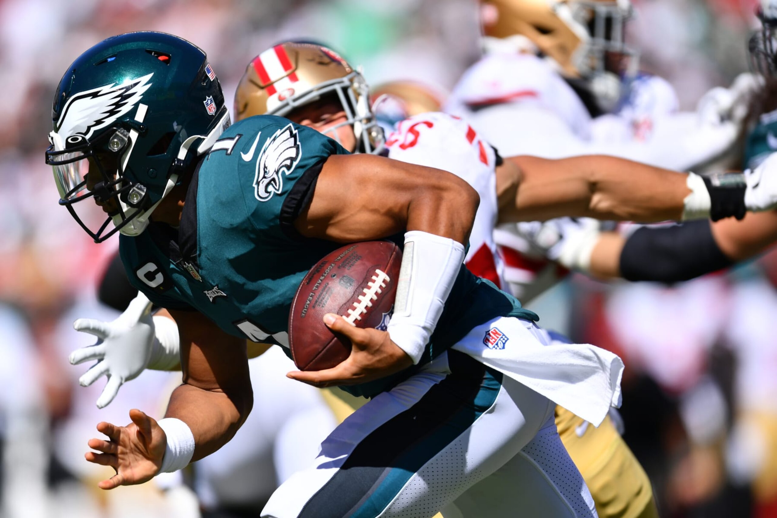 PHILADELPHIA, PA - SEPTEMBER 19: Philadelphia Eagles QB Jalen Hurts (1) carries the ball past San Francisco 49ers DL Nick Bosa (97) in the second half during the game between the San Francisco 49ers and Philadelphia Eagles on September 19, 2021 at Lincoln Financial Field in Philadelphia, PA. (Photo by Kyle Ross/Icon Sportswire via Getty Images)
