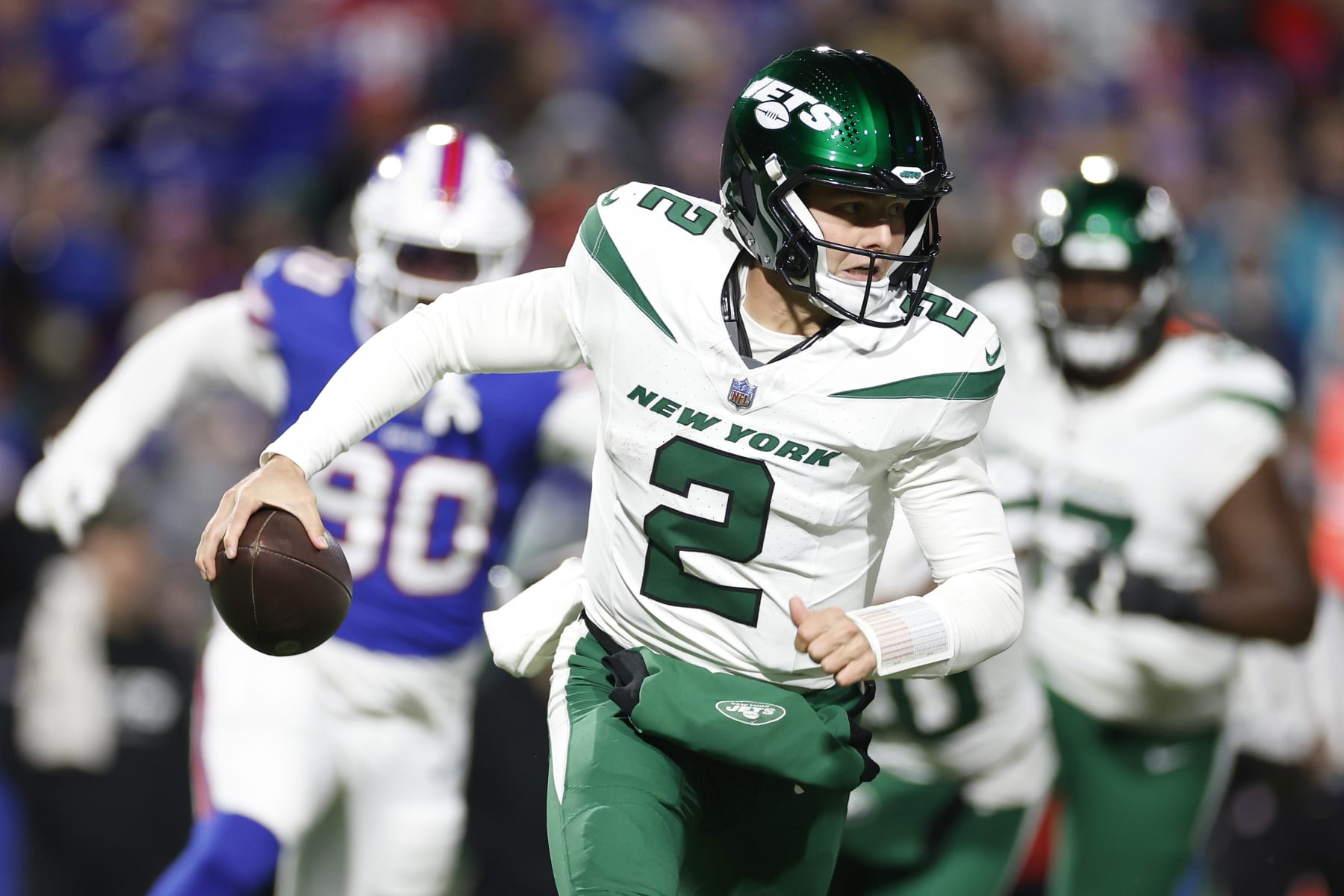 ORCHARD PARK, NEW YORK - NOVEMBER 19: Zach Wilson #2 of the New York Jets scrambles in the second quarter against the Buffalo Bills at Highmark Stadium on November 19, 2023 in Orchard Park, New York. (Photo by Sarah Stier/Getty Images)