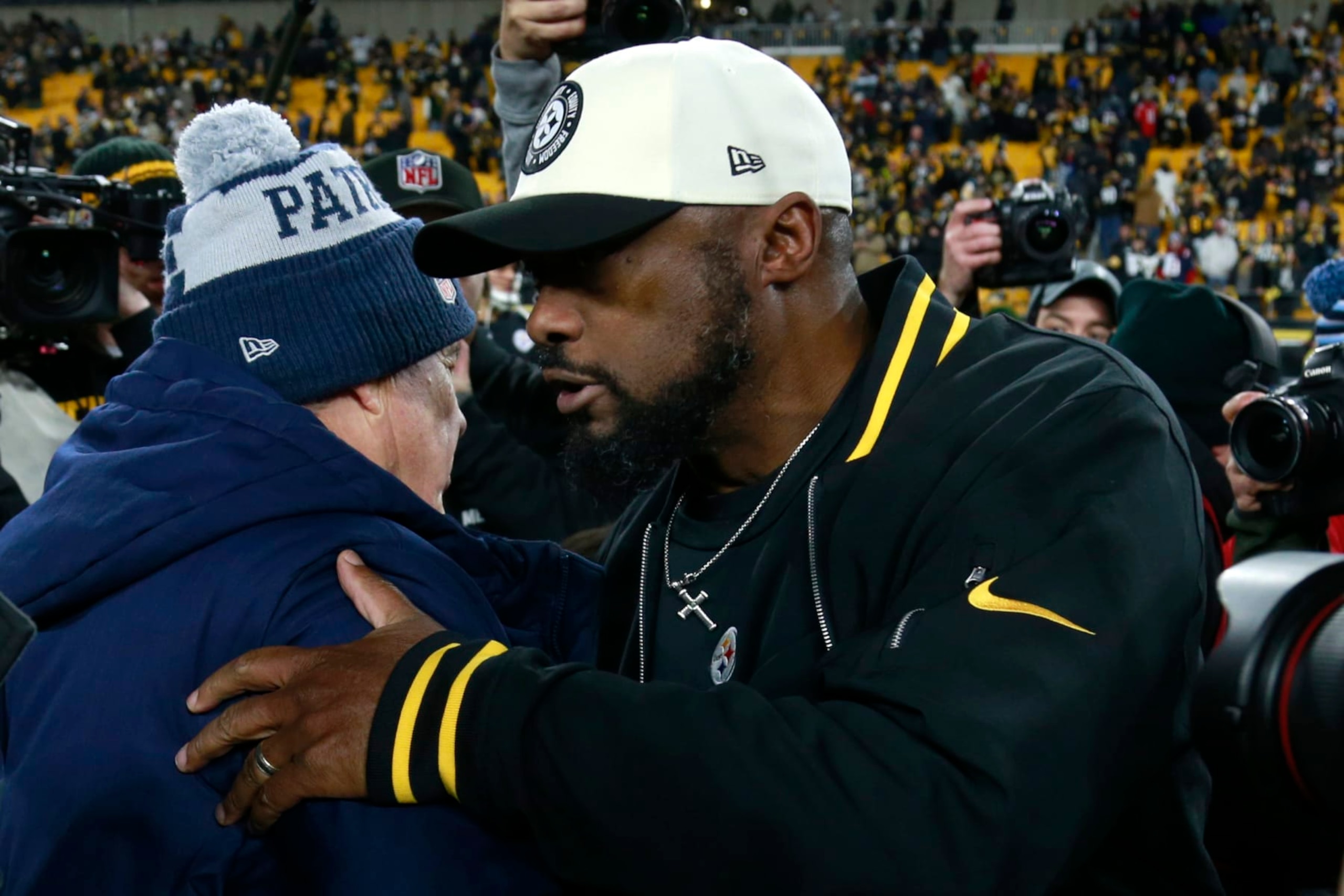 PITTSBURGH, PENNSYLVANIA - DECEMBER 07: New England Patriots head coach Bill Belichick and Pittsburgh Steelers head coach Mike Tomlin speak after the game at Acrisure Stadium on December 07, 2023 in Pittsburgh, Pennsylvania. (Photo by Justin K. Aller/Getty Images) PITTSBURGH, PENNSYLVANIA - DECEMBER 07: New England Patriots head coach Bill Belichick and Pittsburgh Steelers head coach Mike Tomlin speak after the game at Acrisure Stadium on December 07, 2023 in Pittsburgh, Pennsylvania. (Photo by Justin K. Aller/Getty Images)