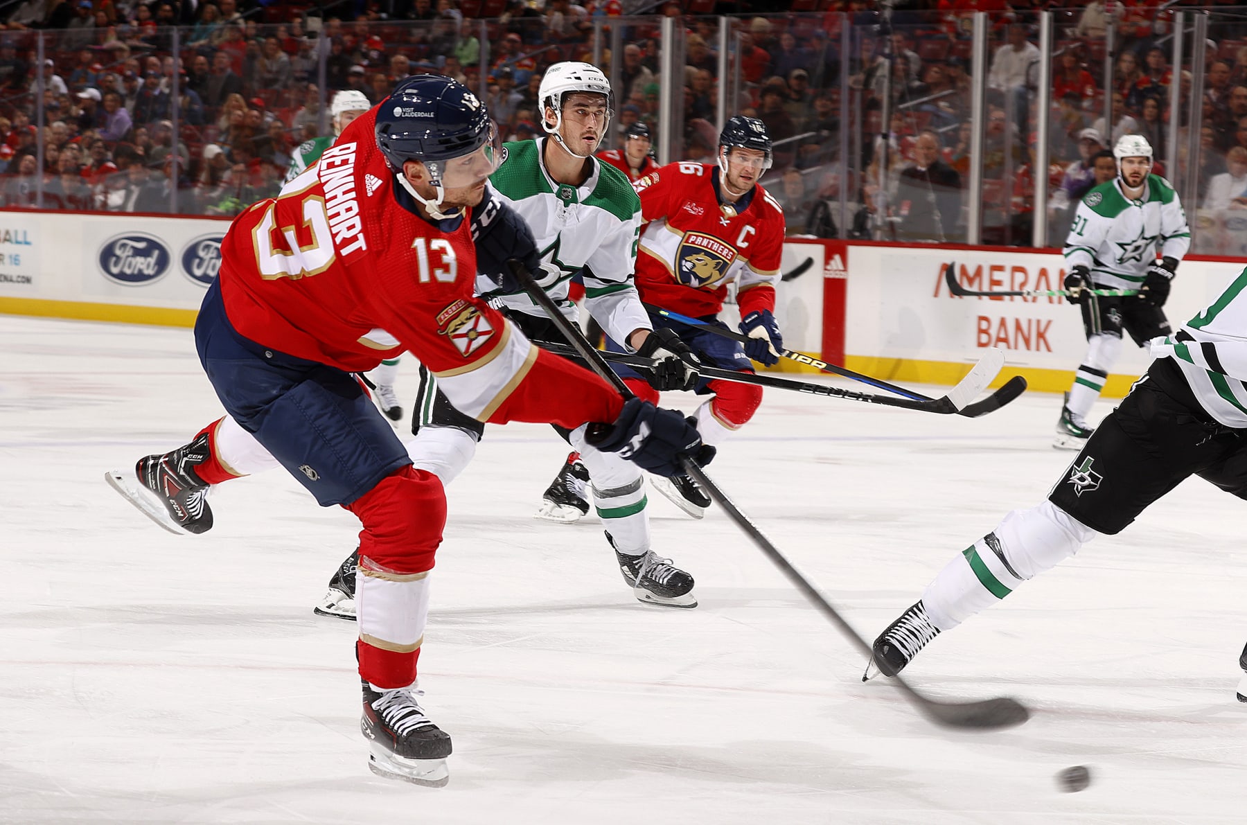SUNRISE, FLORIDA - DECEMBER 6: Sam Reinhart #13 of the Florida Panthers shoots the puck during first period action against the Dallas Stars at the Amerant Bank Arena on December 6, 2023 in Sunrise, Florida. (Photo by Eliot J. Schechter/NHLI via Getty Images)