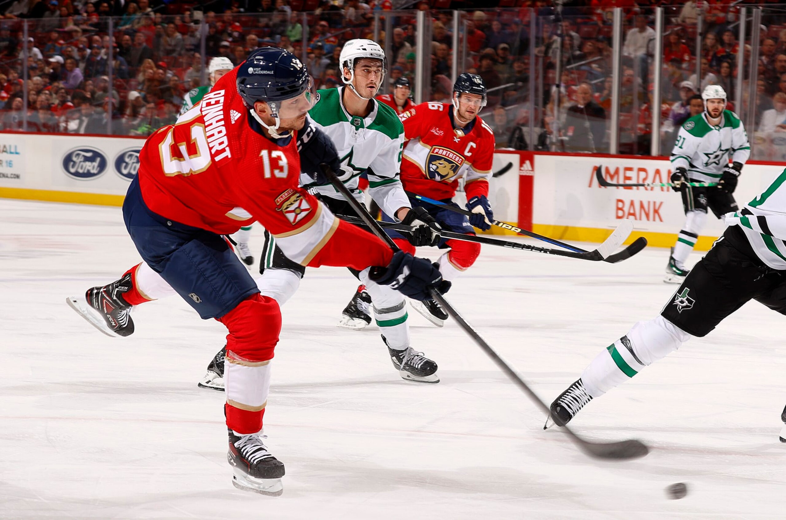 SUNRISE, FLORIDA - DECEMBER 6: Sam Reinhart #13 of the Florida Panthers shoots the puck during first period action against the Dallas Stars at the Amerant Bank Arena on December 6, 2023 in Sunrise, Florida. (Photo by Eliot J. Schechter/NHLI via Getty Images)