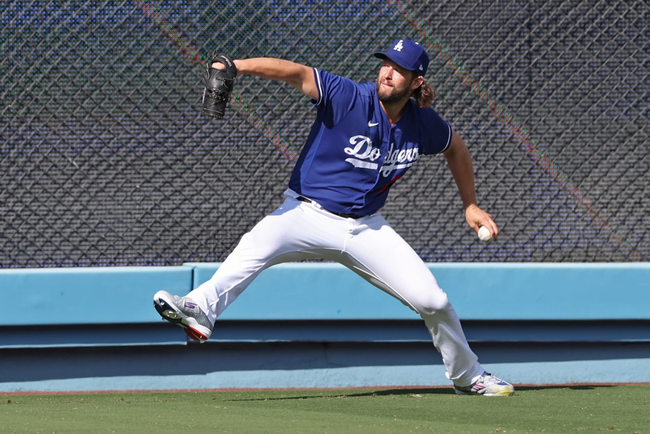 LOS ANGELES, CA - OCTOBER 09: Clayton Kershaw #22 of the Los Angeles Dodgers warms up prior to Game 2 of the Division Series between the Arizona Diamondbacks and the Los Angeles Dodgers at Dodger Stadium on Monday, October 9, 2023 in Los Angeles, California. (Photo by Rob Leiter/MLB Photos via Getty Images)