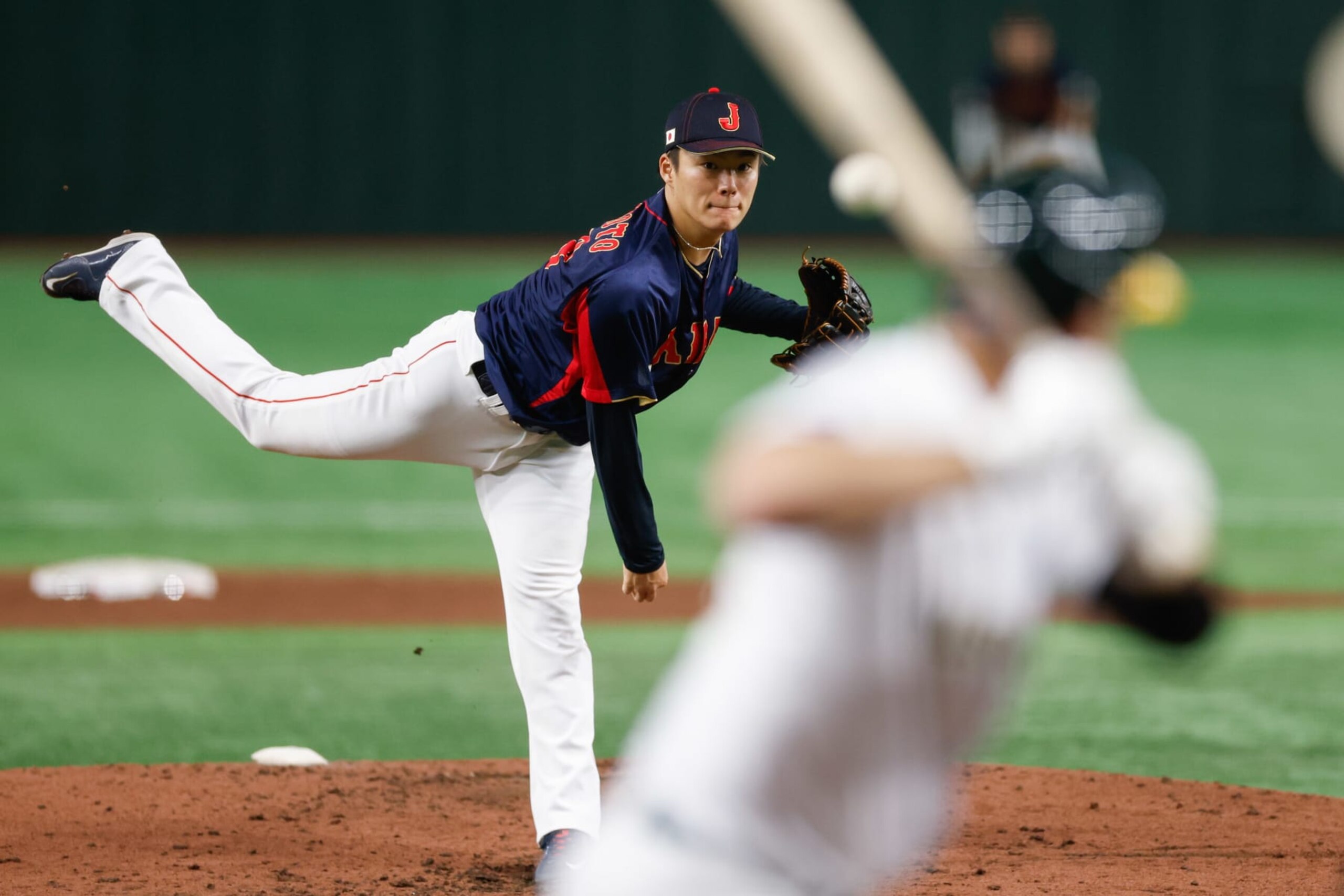 BUNKYO CITY, JAPAN - MARCH 12:   Yoshinobu Yamamoto #18 of Team Japan pitches during Game 8 of Pool B between Team Japan and Team Australia at Tokyo Dome on Sunday, March 12, 2023 in Bunkyo City, Japan. (Photo by Yuki Taguchi/WBCI/MLB Photos via Getty Images)