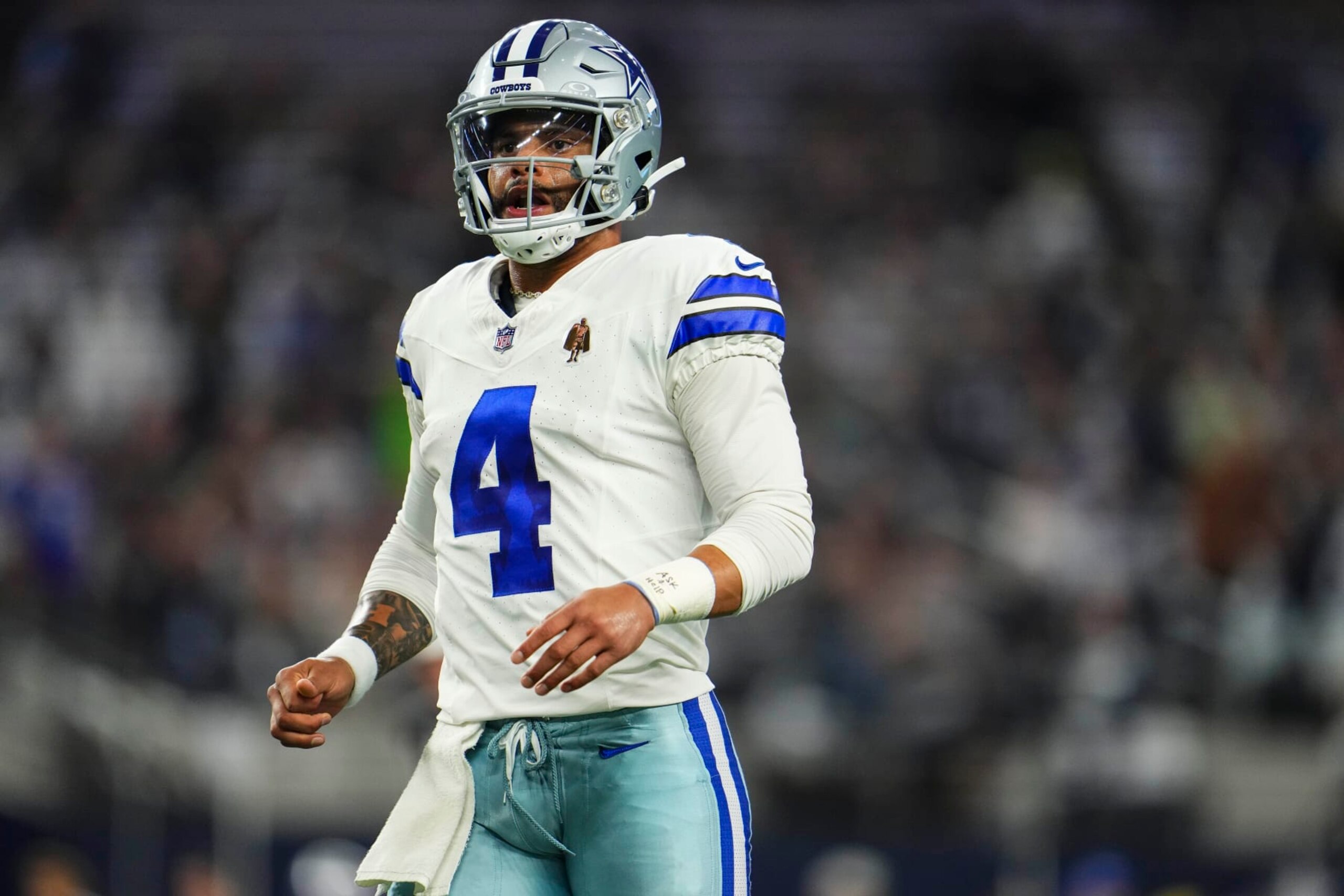ARLINGTON, TX - NOVEMBER 30: Dak Prescott #4 of the Dallas Cowboys looks on from the field during an NFL football game against the Seattle Seahawks at AT&T Stadium on November 30, 2023 in Arlington, Texas. (Photo by Cooper Neill/Getty Images)