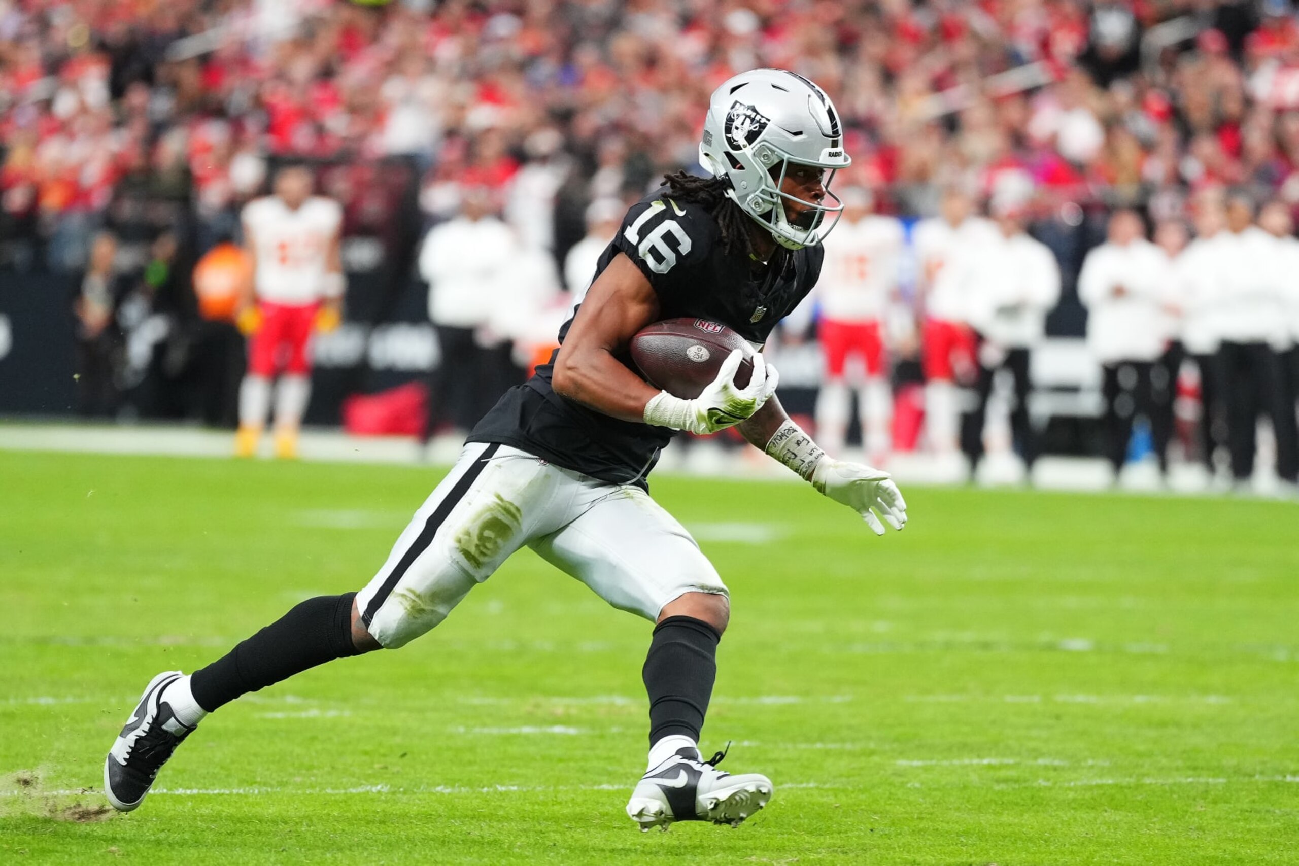 LAS VEGAS, NEVADA - NOVEMBER 26: Jakobi Meyers #16 of the Las Vegas Raiders runs with the ball during the first quarter against the Kansas City Chiefs at Allegiant Stadium on November 26, 2023 in Las Vegas, Nevada. (Photo by Jeff Bottari/Getty Images)
