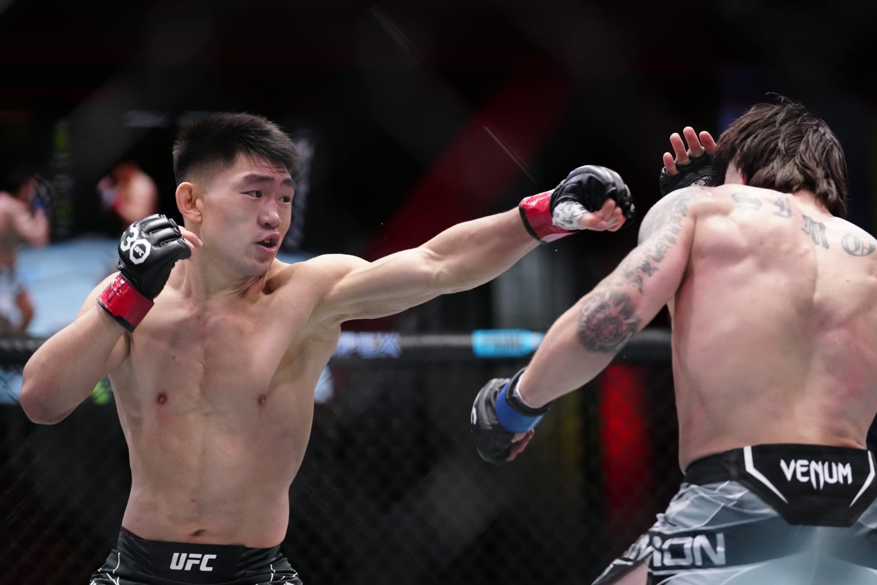 Song Yadong punches Ricky Simon