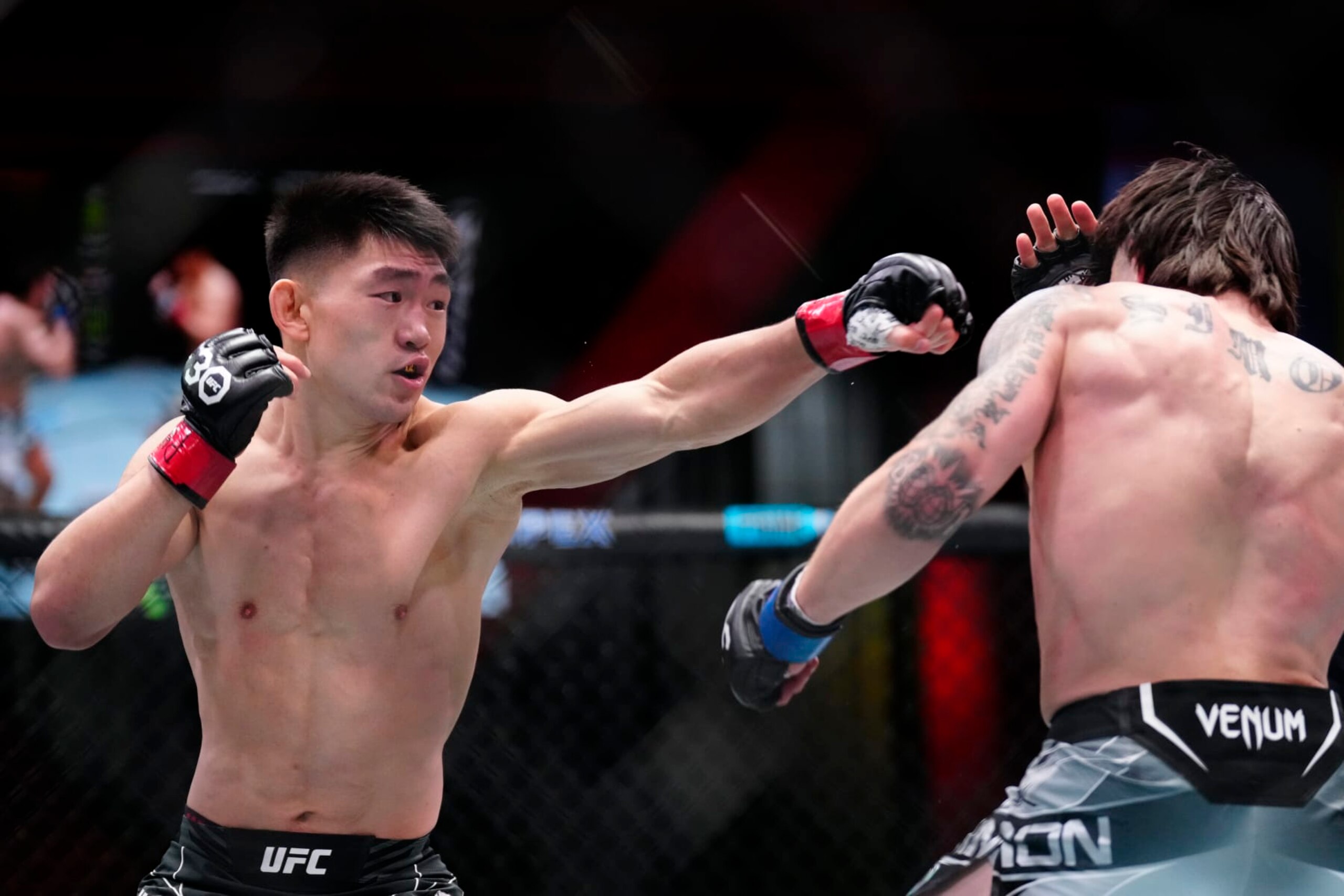 Song Yadong punches Ricky Simon