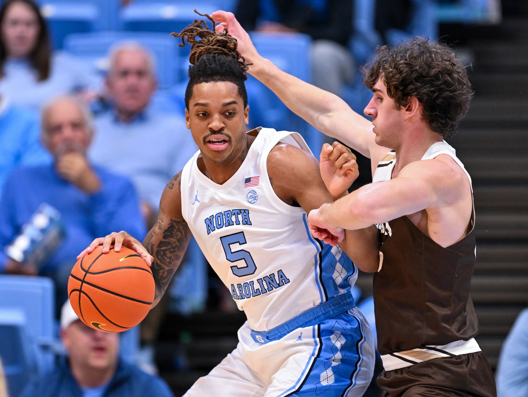 CHAPEL HILL, NORTH CAROLINA - NOVEMBER 12: Armando Bacot #5 of the North Carolina Tar Heels moves the ball against Dominic Parolin #35 of the Lehigh Mountain Hawks during the game at the Dean E. Smith Center on November 12, 2023 in Chapel Hill, North Carolina. The Tar Heels won 90-68. (Photo by Grant Halverson/Getty Images)